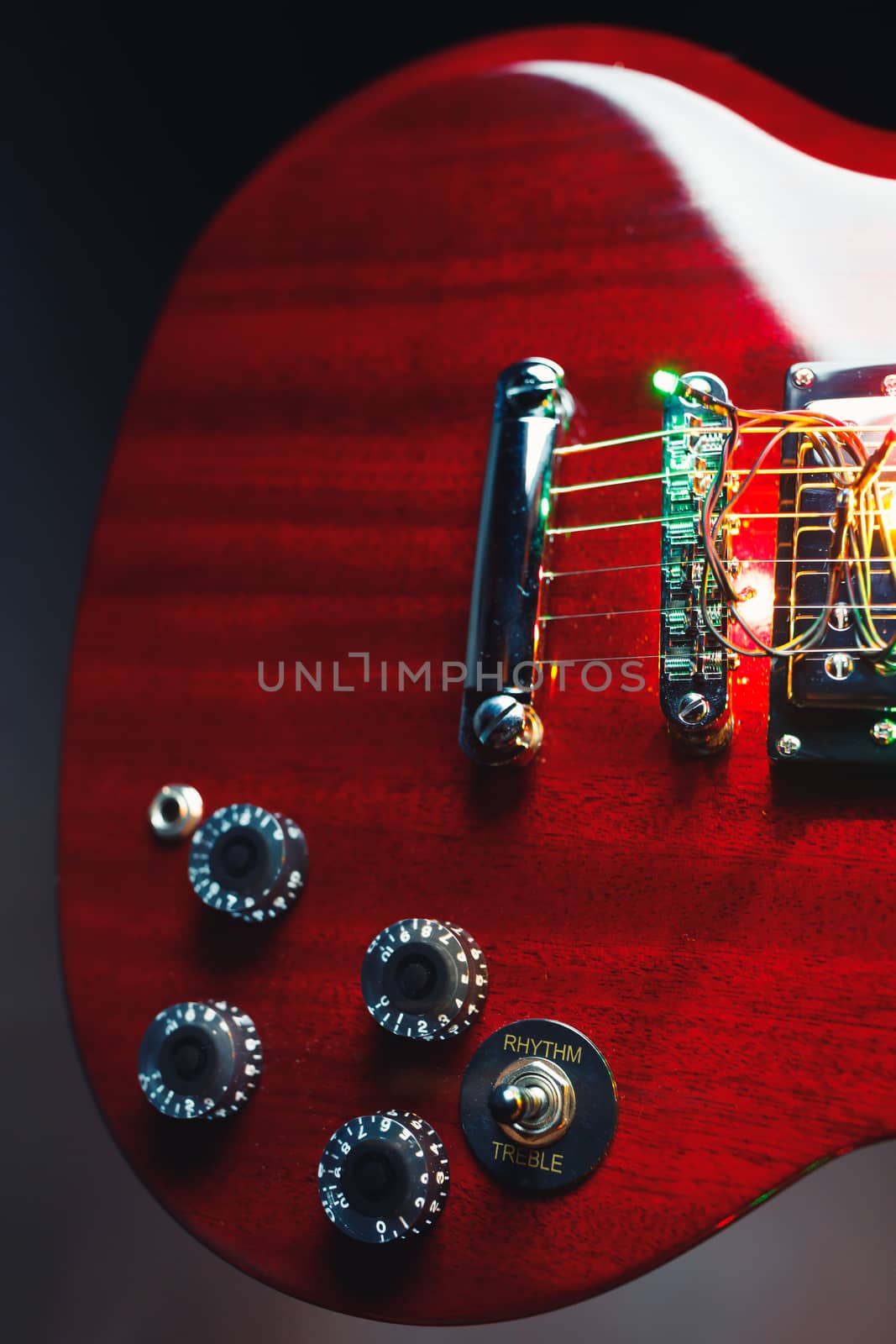 part of red guitar, close-up view
