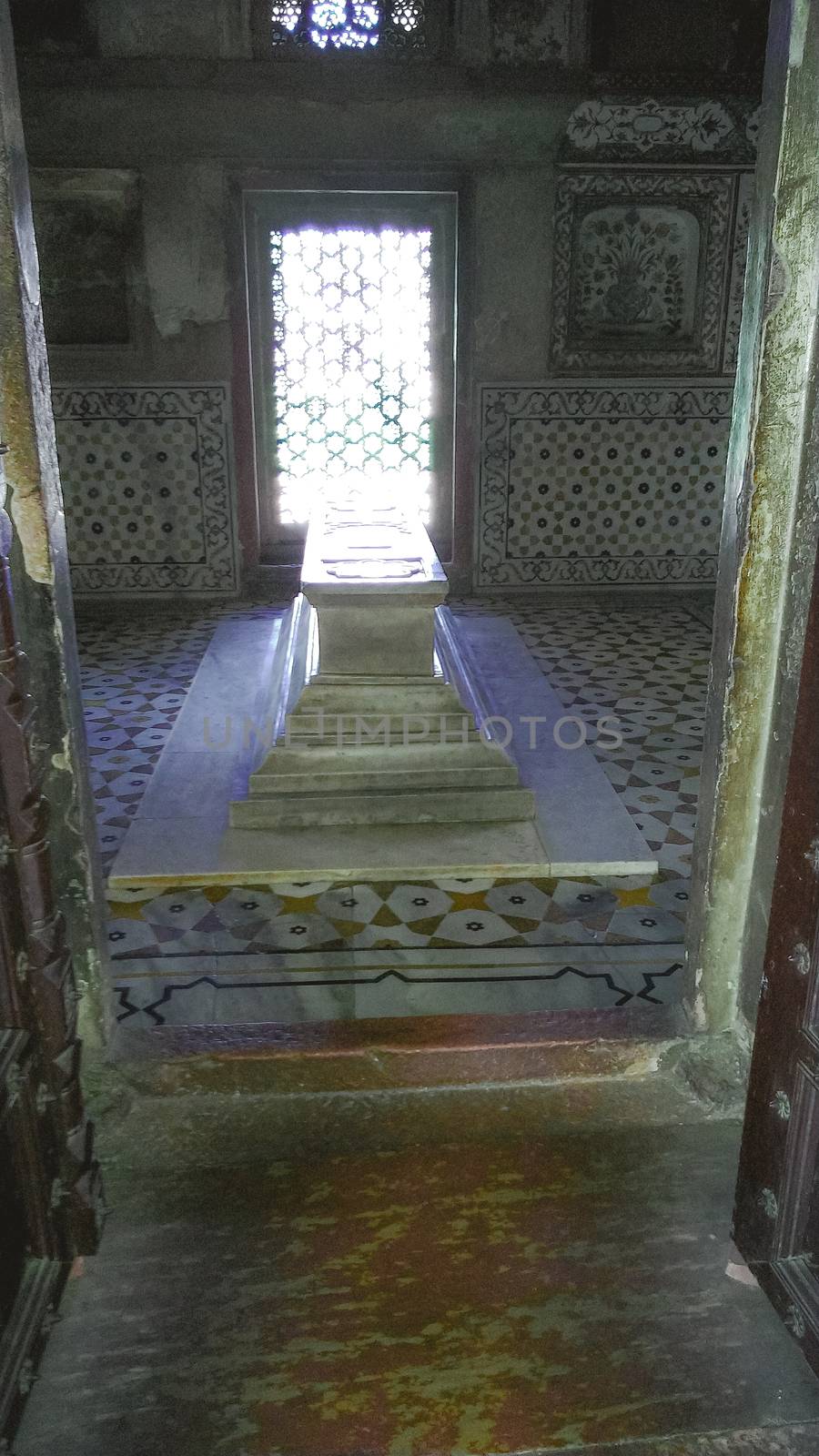 Inside the Taj Mahal, the cenotaphs honoring Mumtaz Mahal and Shah Jahan are enclosed in an eight-sided chamber ornamented with semi-precious stones and marble. Agra, India, South Asia August 15, 2019