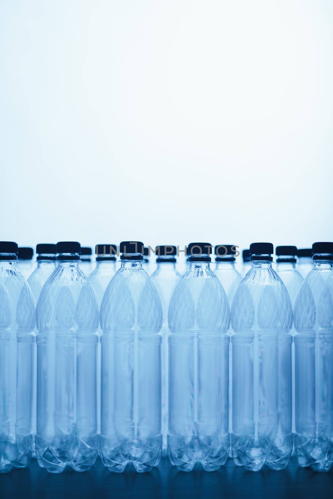 empty plastic bottle silhouettes on blue background