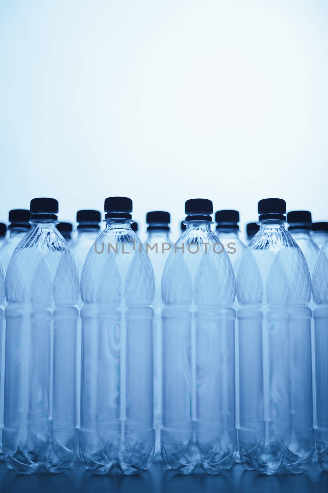 empty plastic bottle silhouettes on blue background by nikkytok