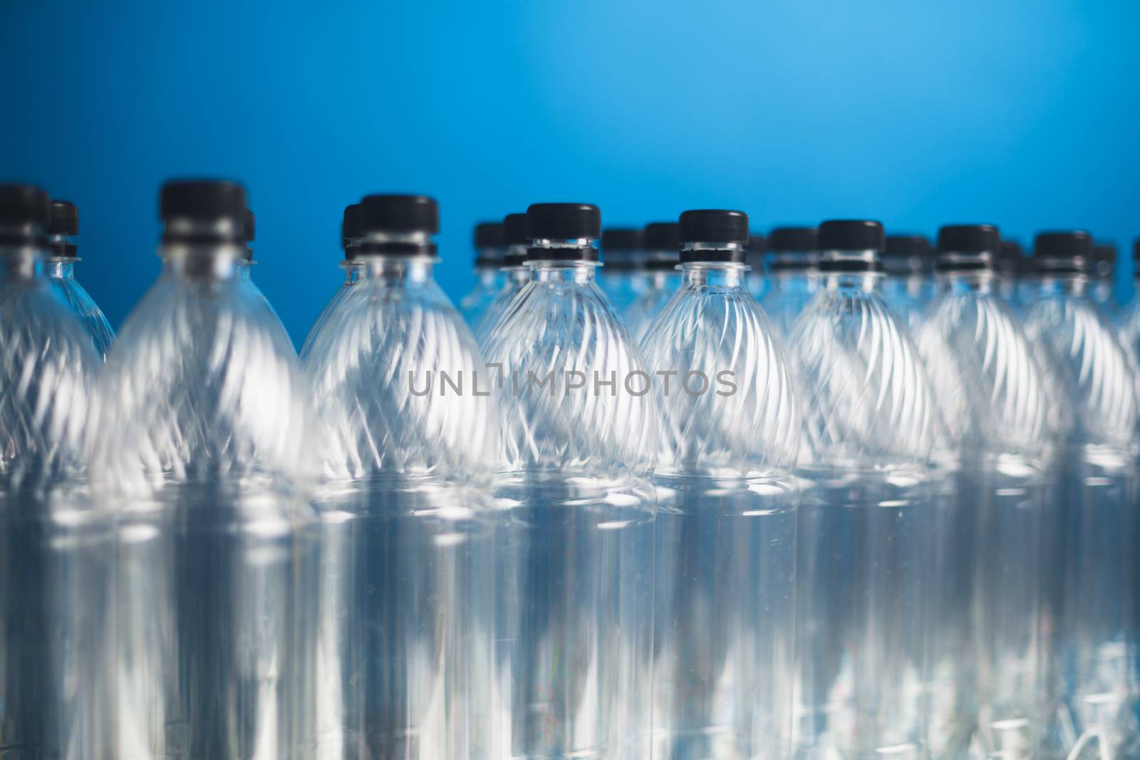 empty plastic bottles on blue background