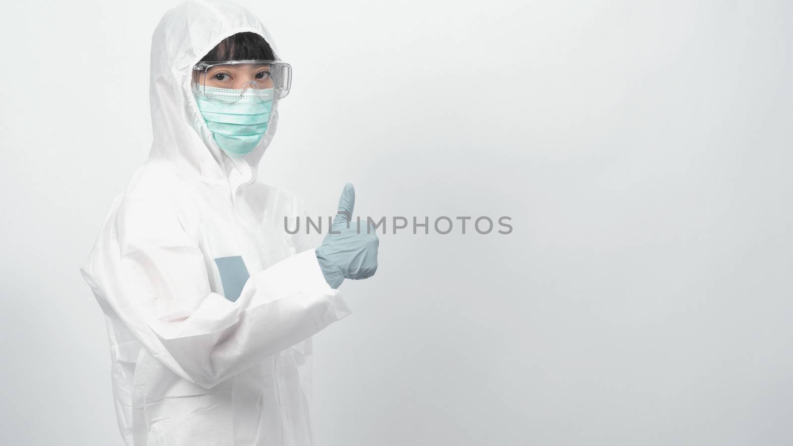 Woman doctor in PPE or personal protection equipment suit  by gnepphoto