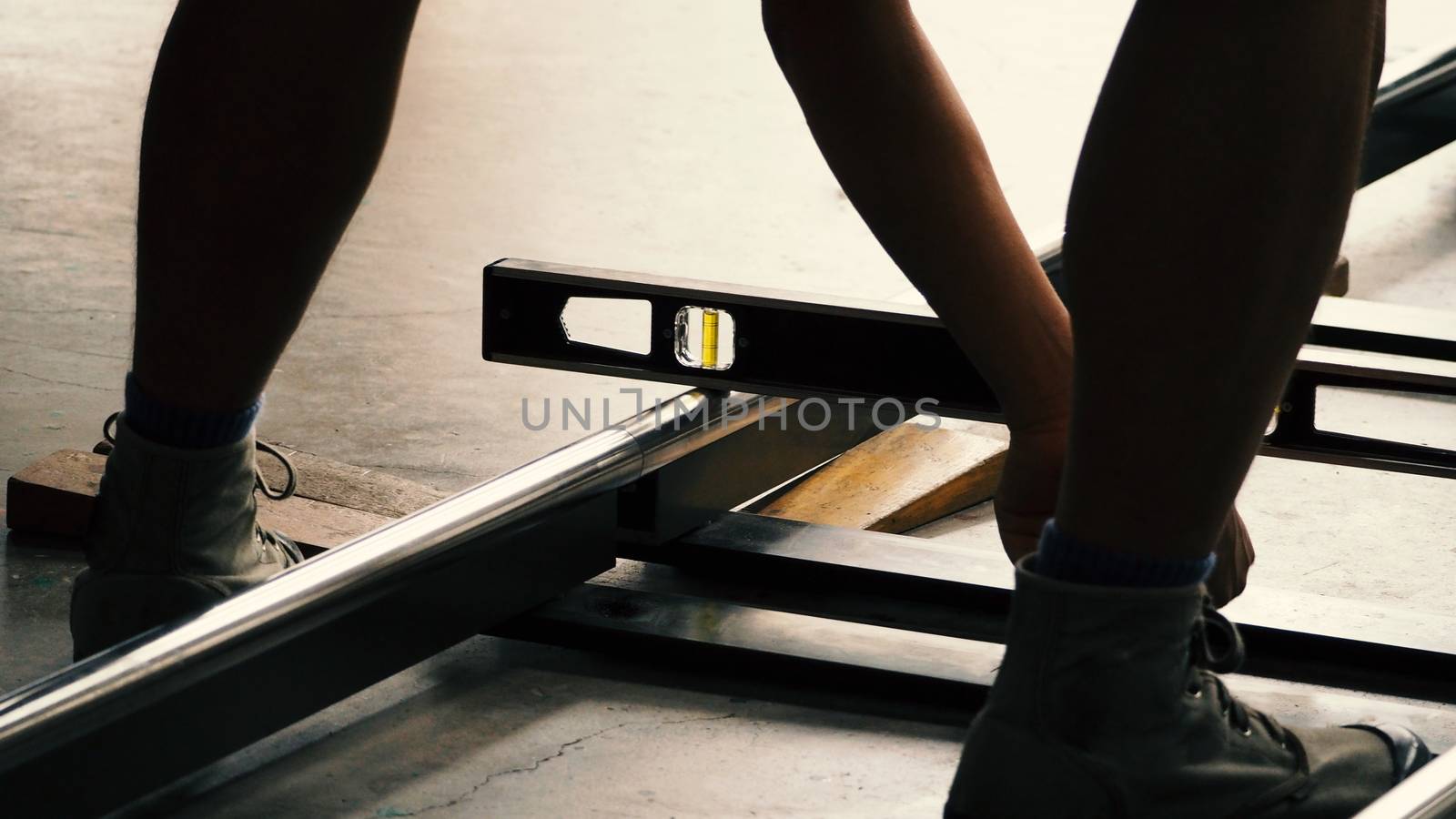 Setting dolly track for video shooting production by gnepphoto