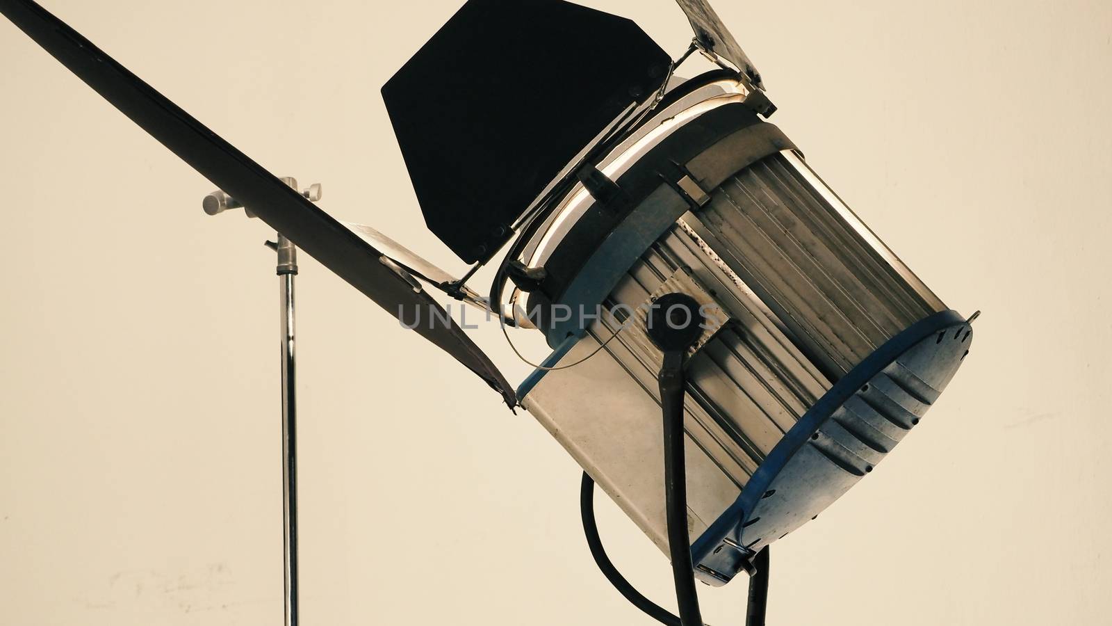 Big LED studio spotlight and tripod for professional video or movie commercial shooting.