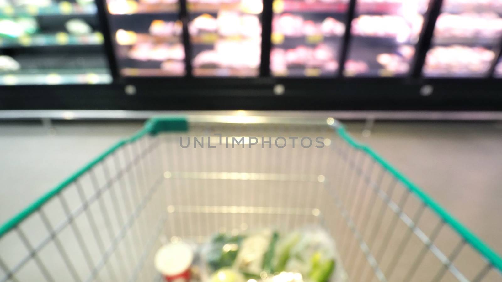 Blurry images of supermarket cart in big shopping department stores and POV or subjective camera angle.