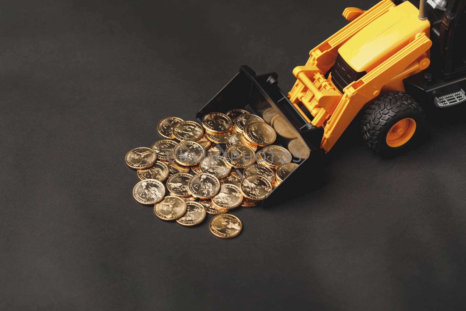 backhoe tractor rake up money coins