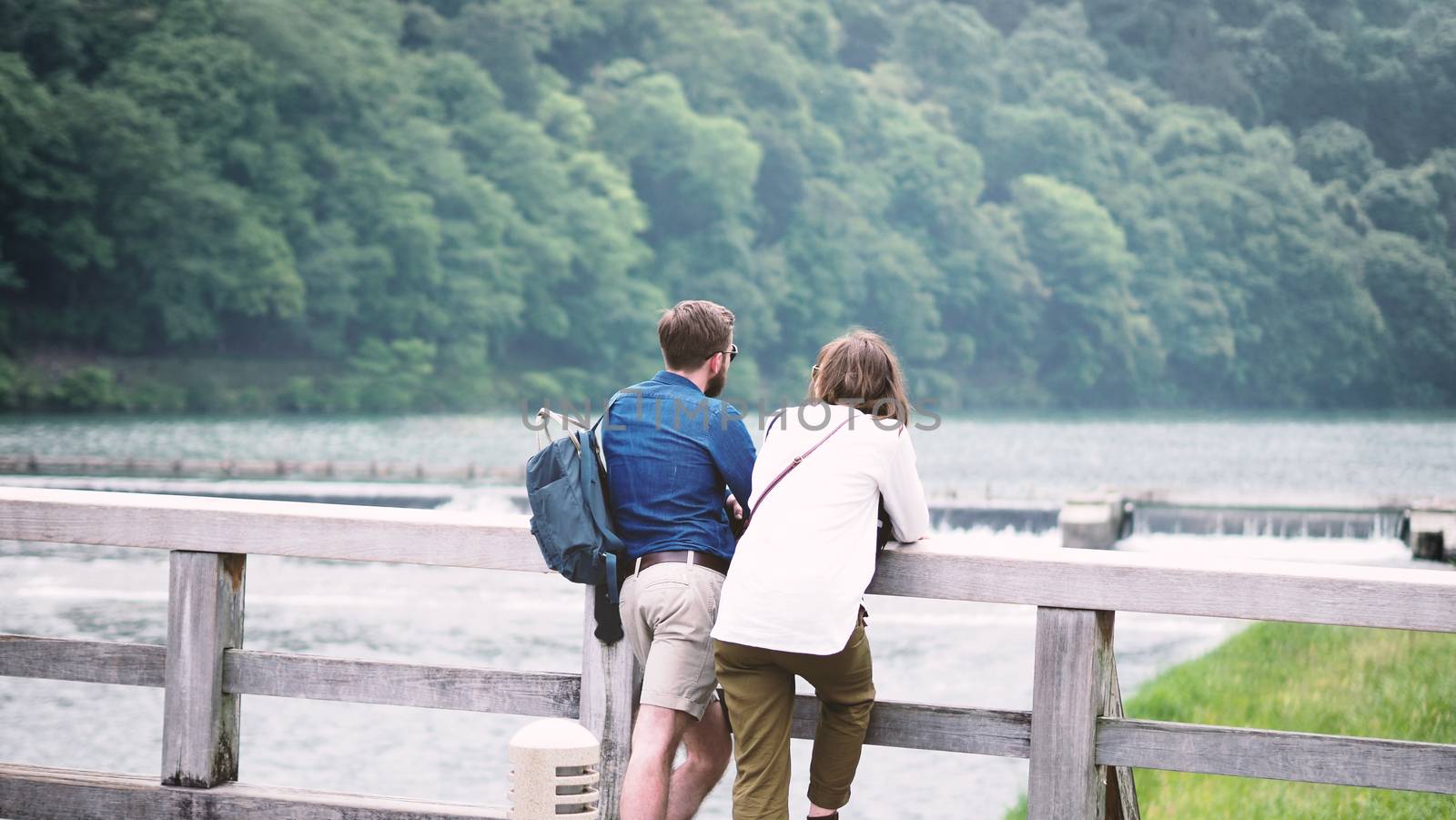 Couple casual traveller standing on bridge in Japan by gnepphoto