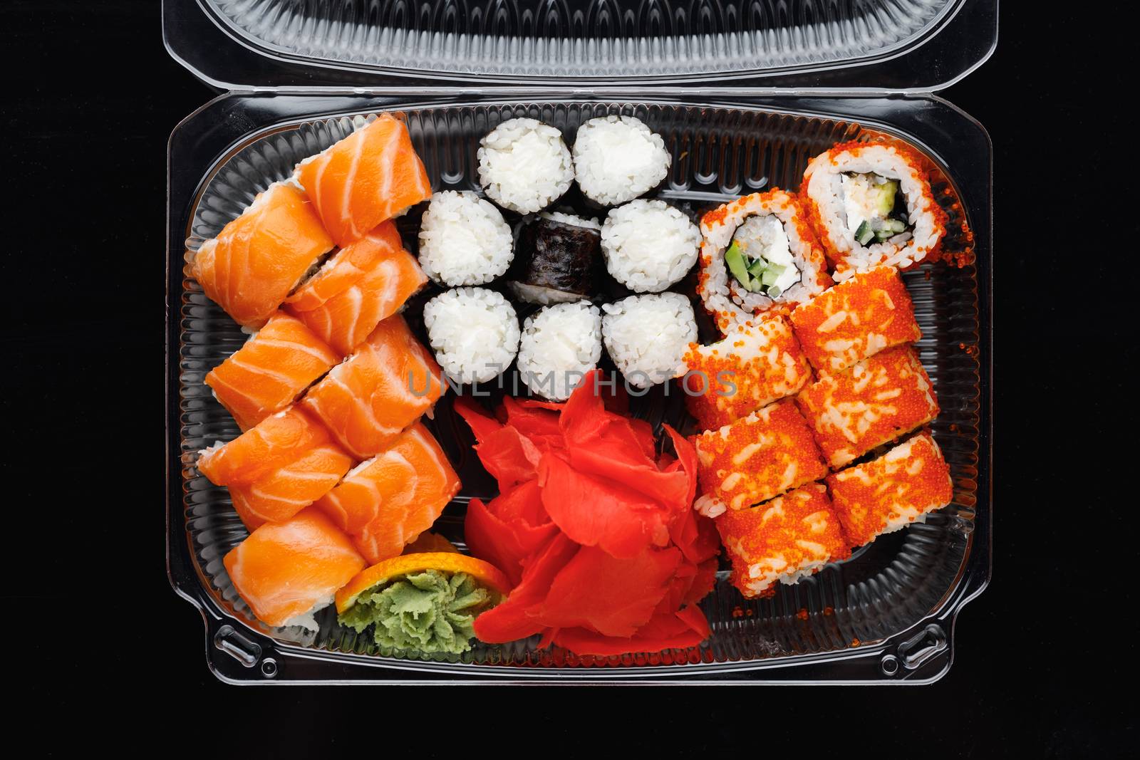 sushi rolls mix in a plastic box container