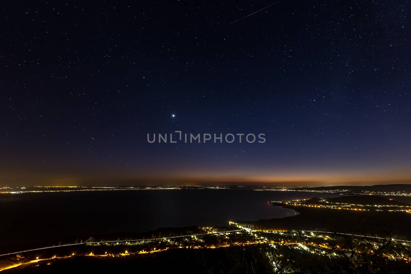 Starry sky at night over the lake Balaton in Hungary