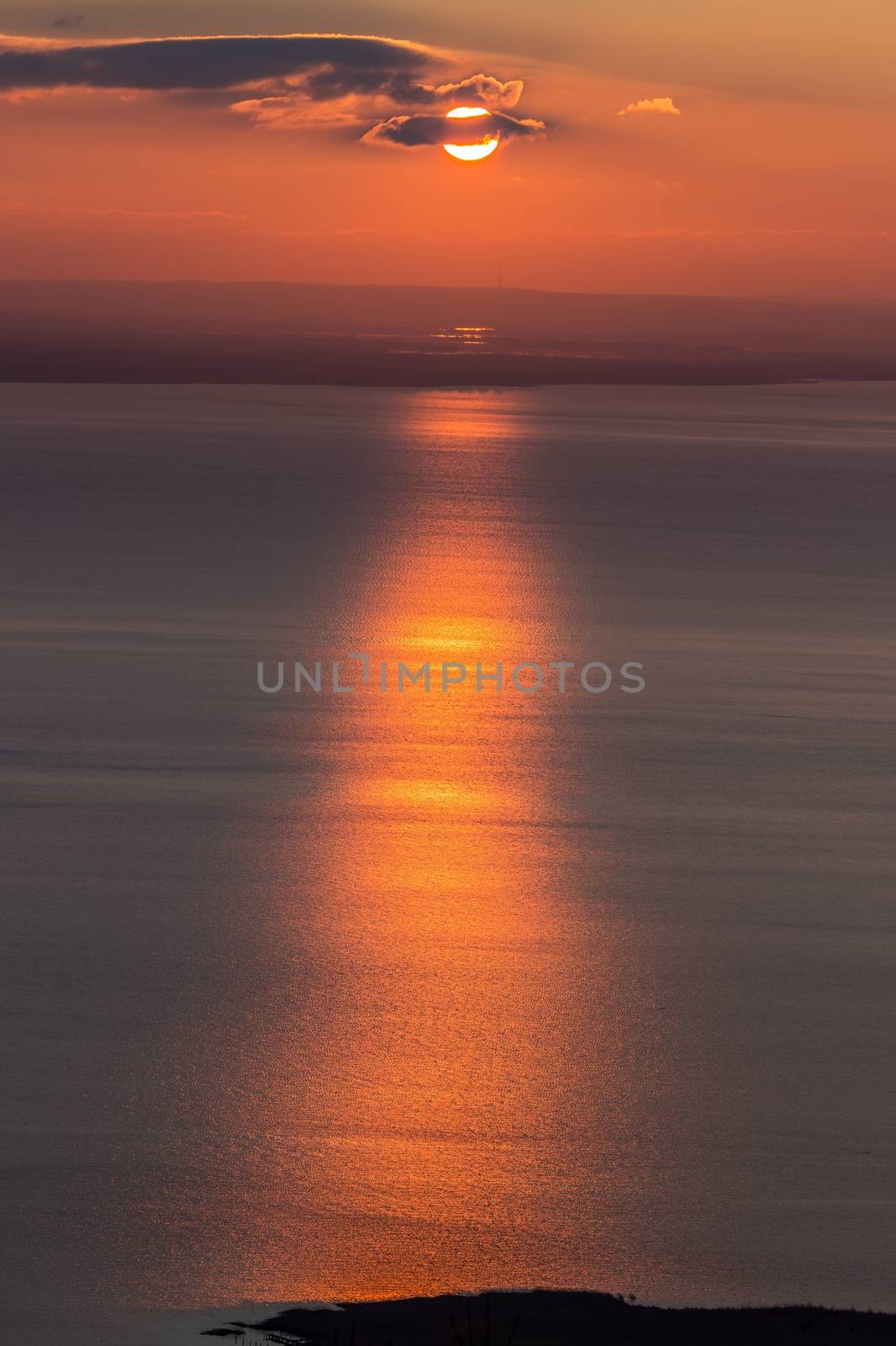 Beautiful sunset over the lake by Digoarpi
