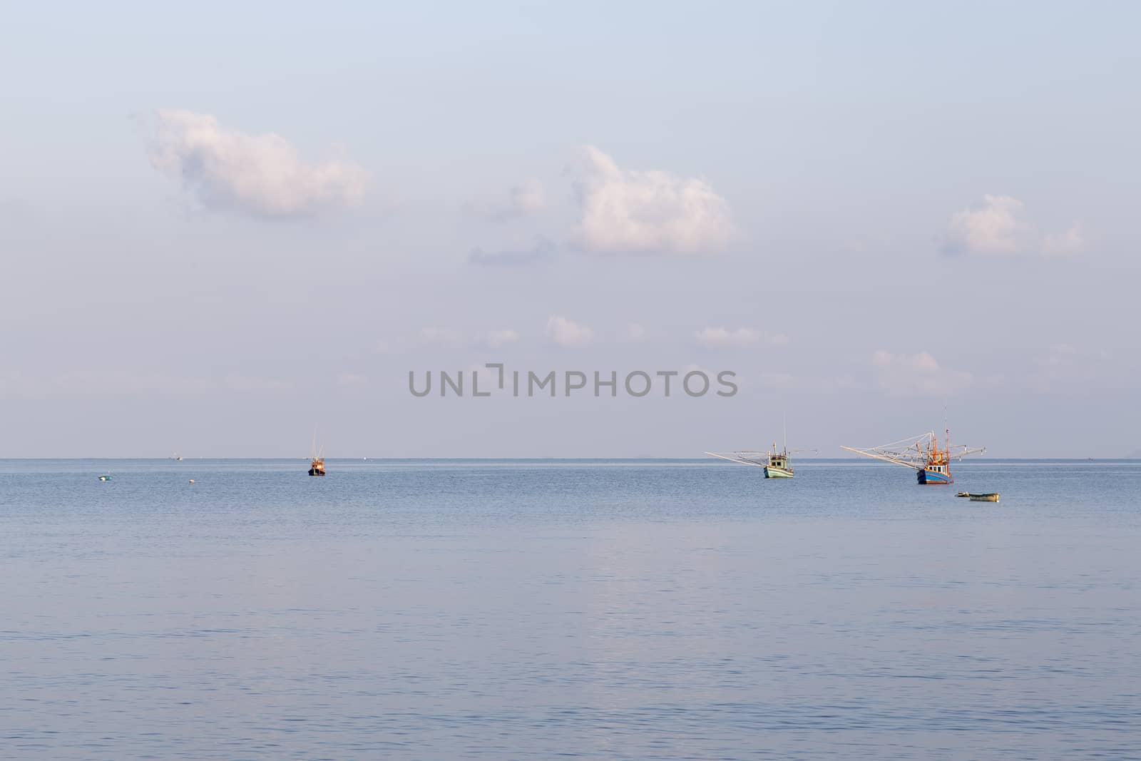 Sea with fishing boats by liewluck