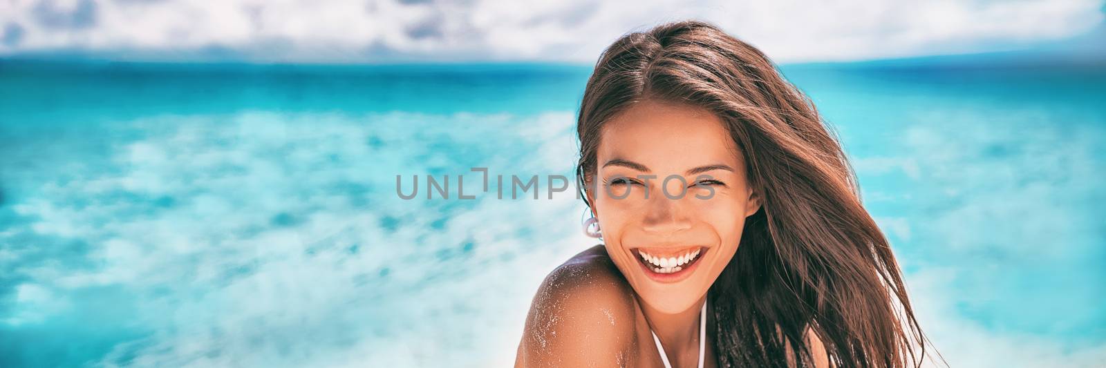 Beautiful Asian woman smiling relaxing on summer beach sunbathing banner panorama by Maridav