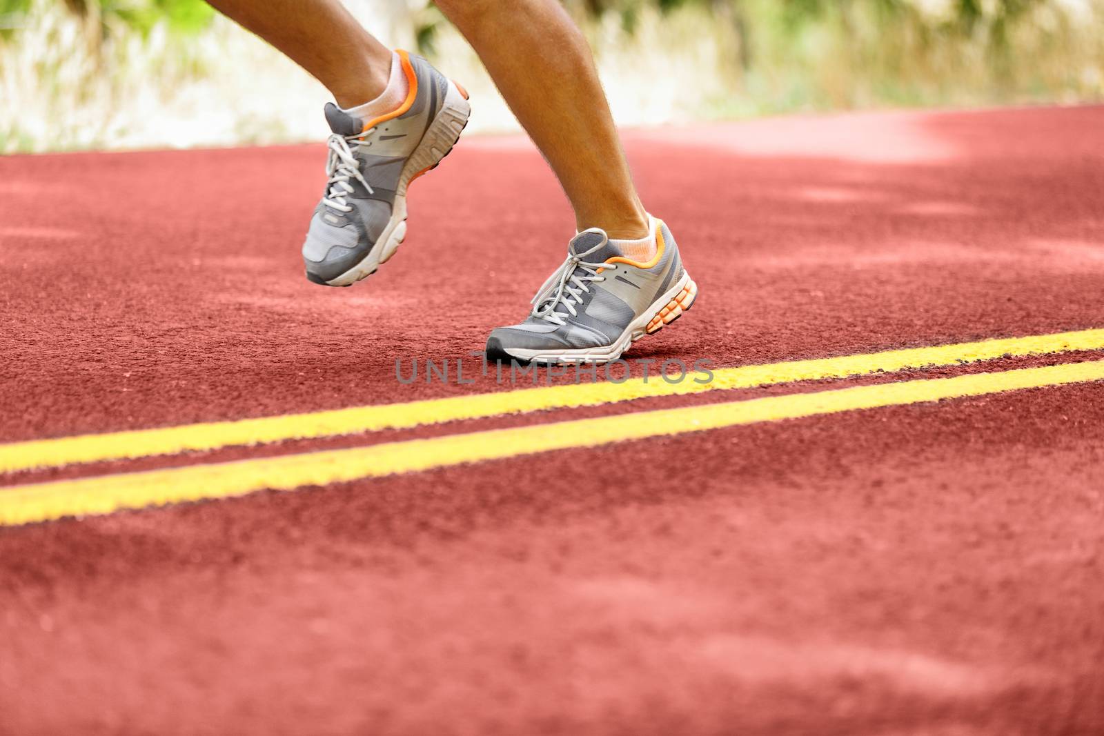 Man Running By Double Yellow Lines On Road by Maridav