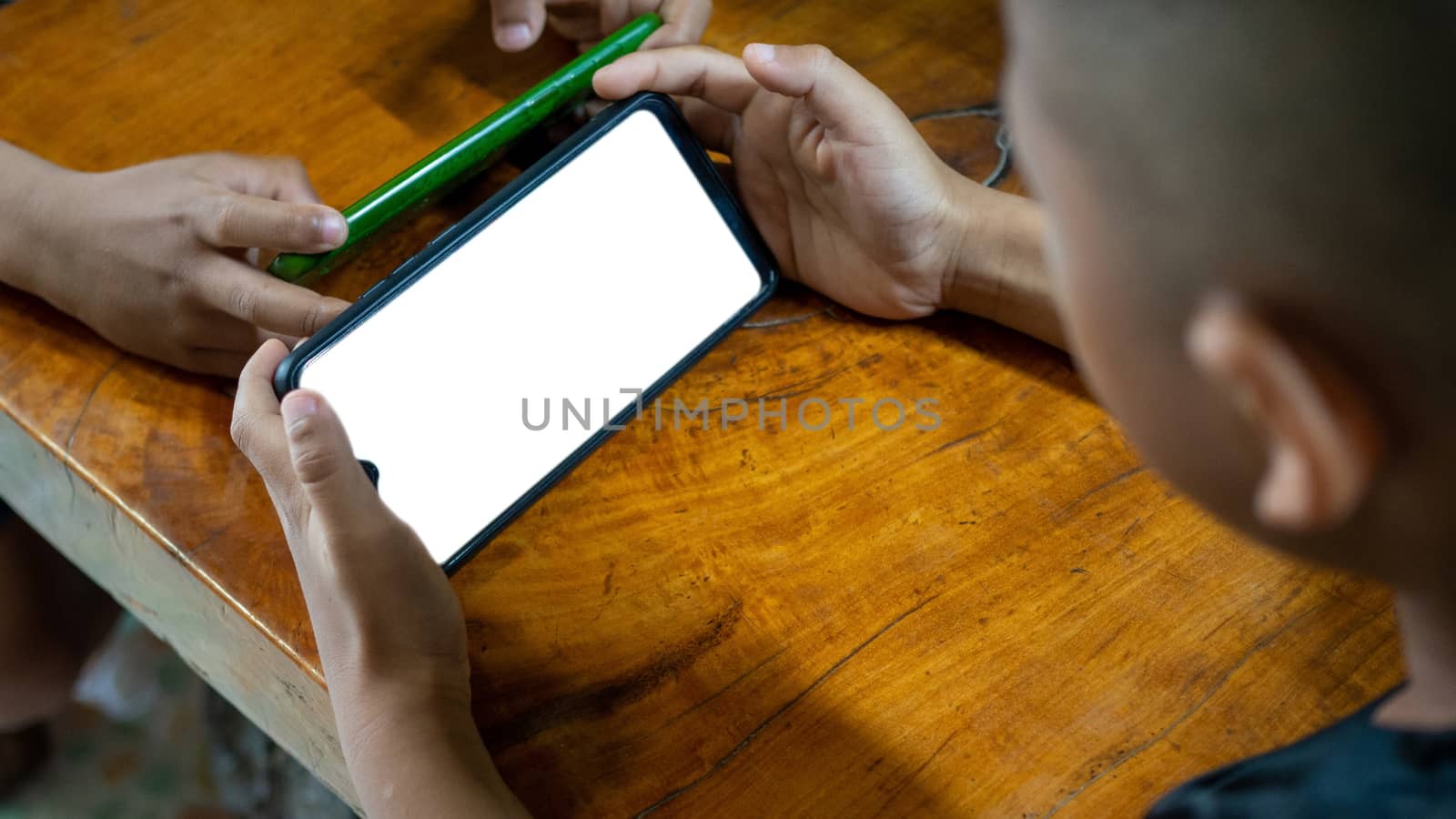 Boy using the smartphone. mockup screen concept. by Unimages2527