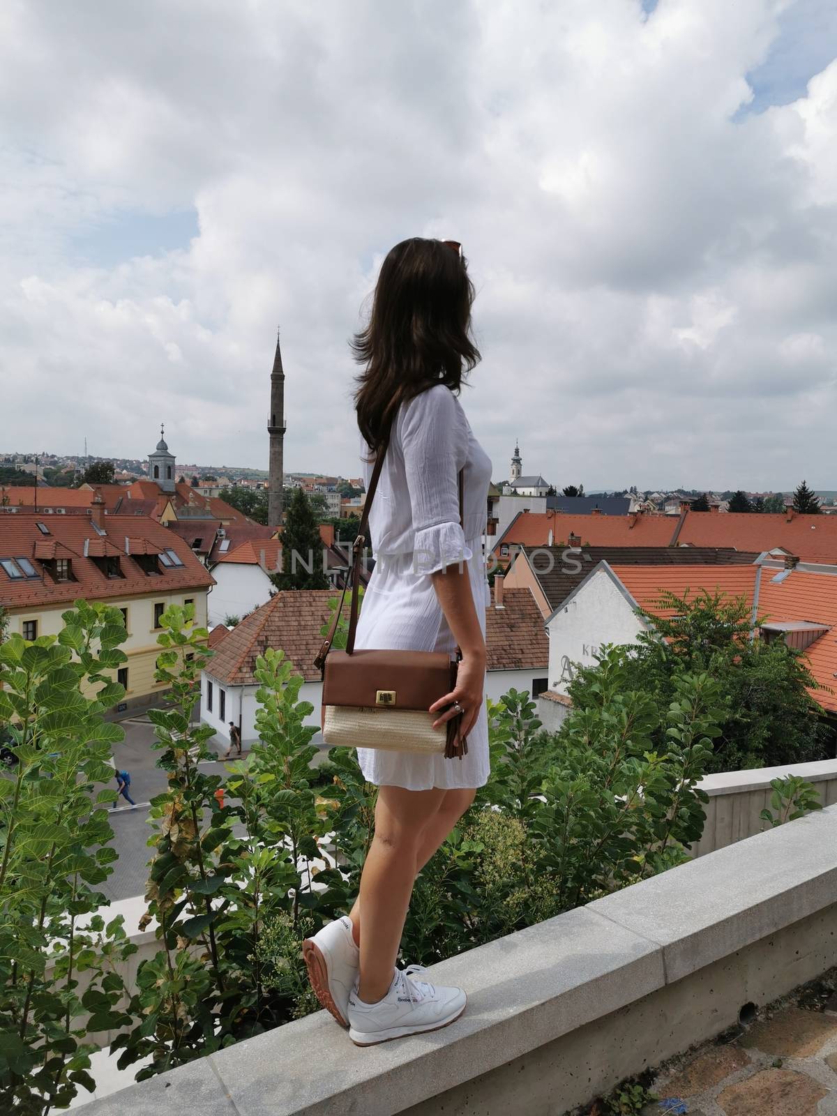 The girl who looks at the city of Eger from the castle by balage941