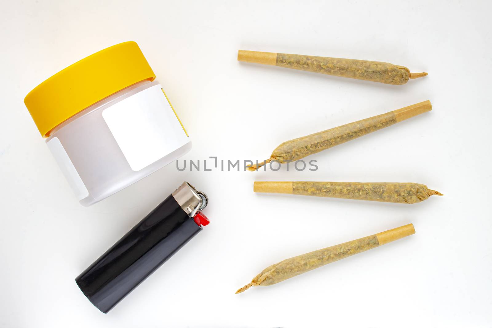 A Cannabis white and yellow plastic packaging container with Cigarettes, Prerolls or Joints and a lighter on a white background