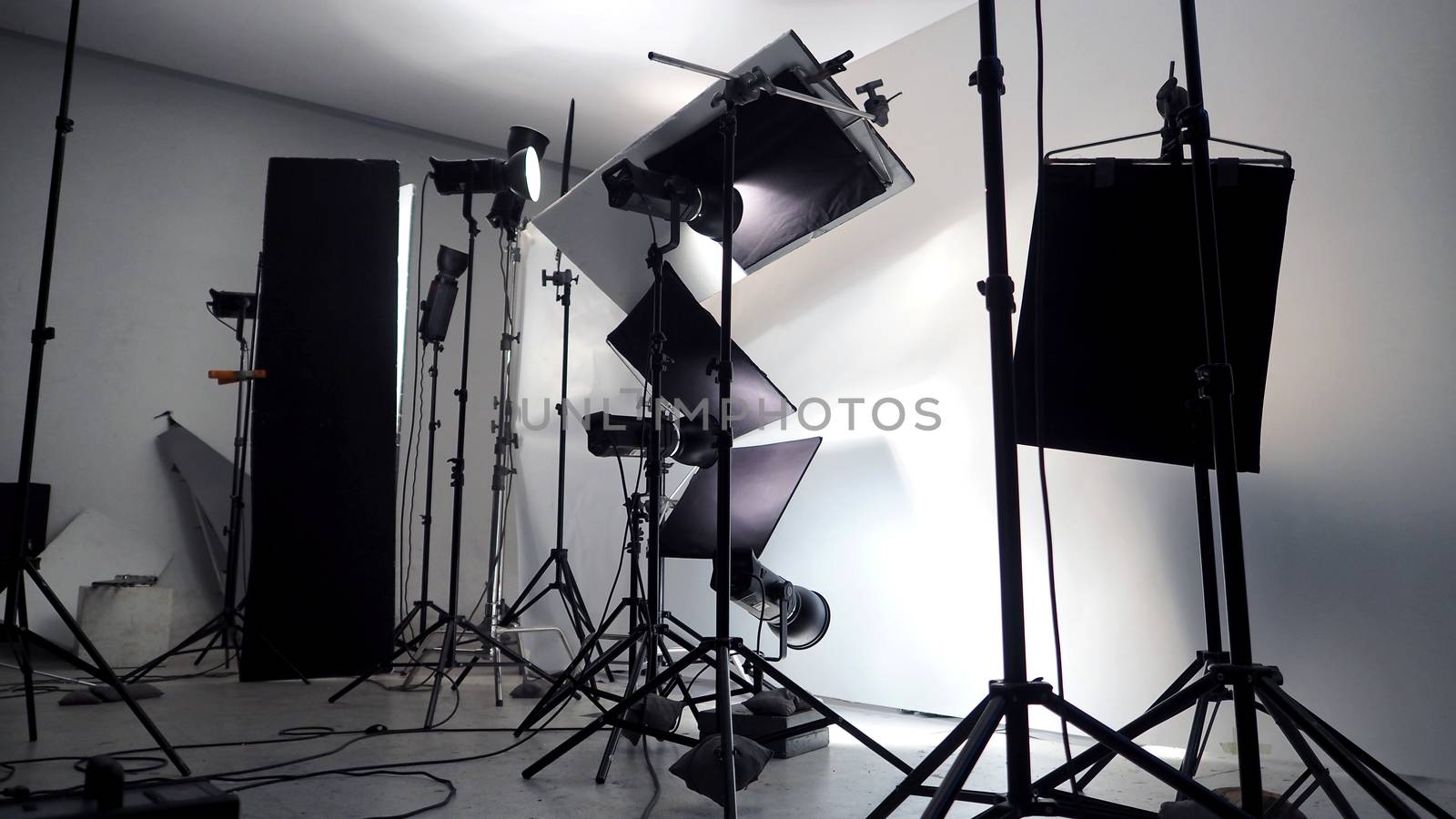 Lighting setup in studio for commercial works by gnepphoto