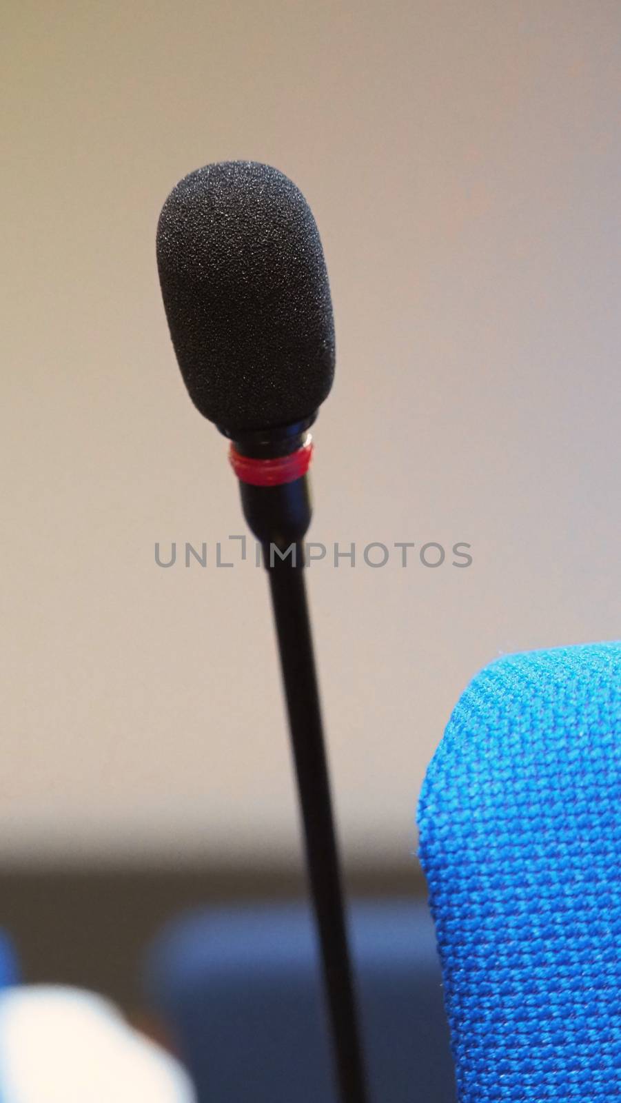 Mini microphone speaker in conference hall by gnepphoto