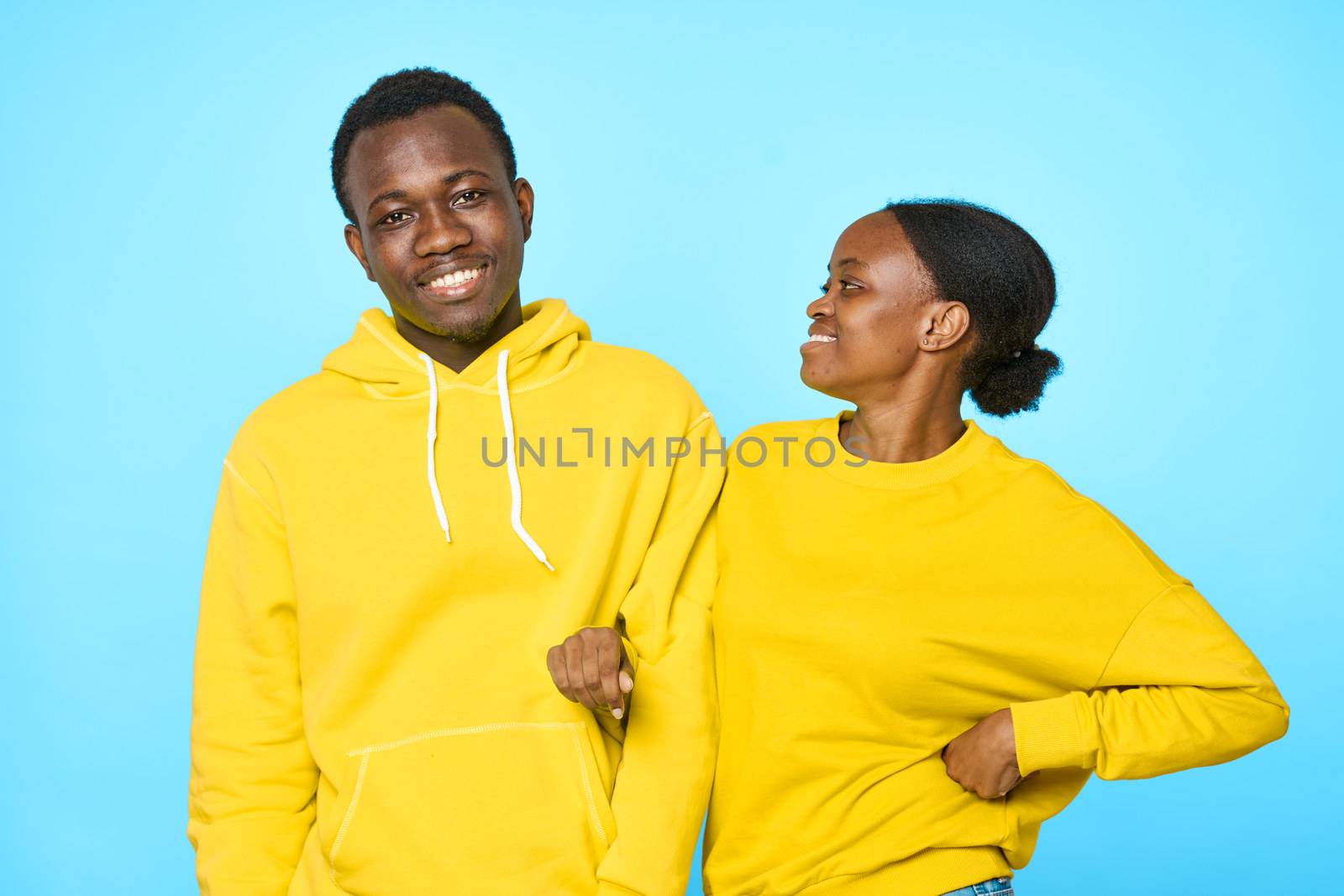 Loving couple African appearance hugs communication dating family blue background