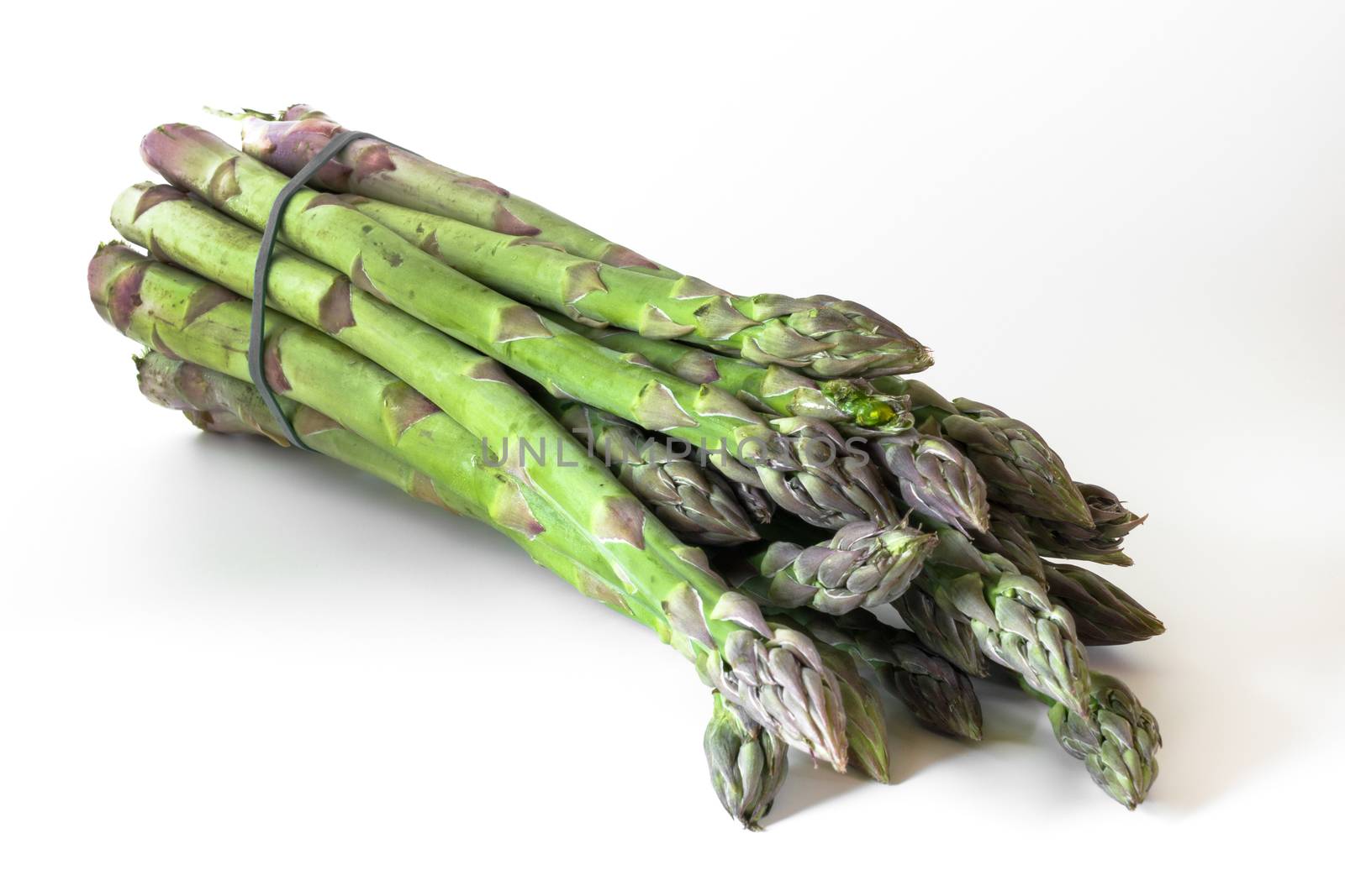 A bundle of uncooked asparagus, on white background.