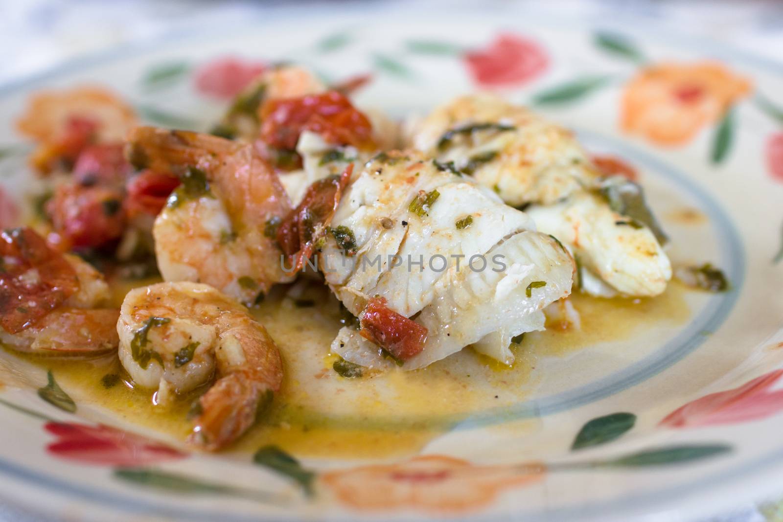 Fish stew with shrimp and cherry tomatoes.