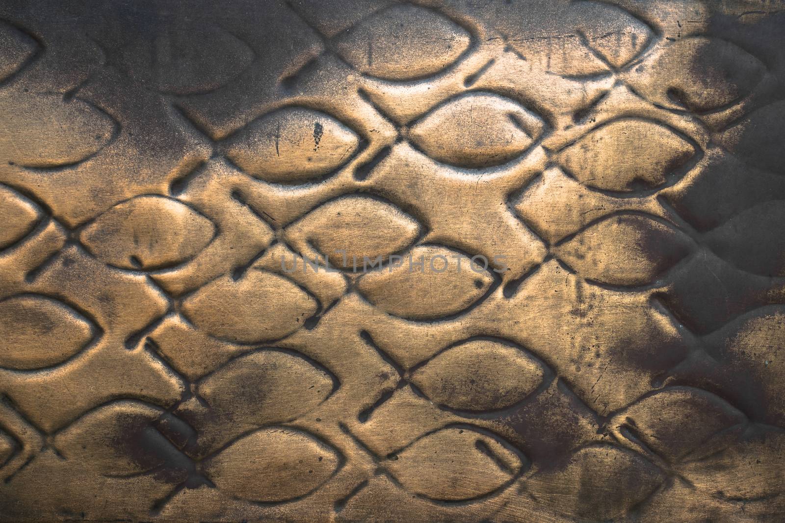 Pattern of fish engraved on a copper plate.
