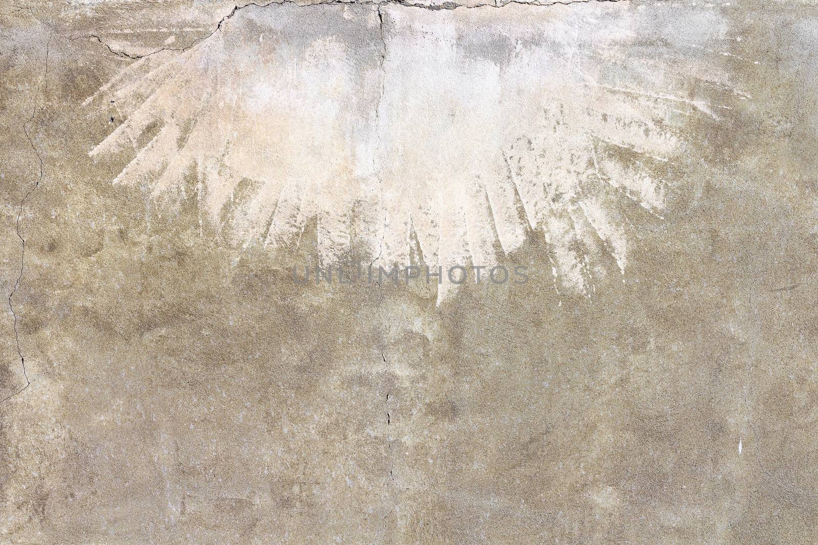 Front view of an old wall sand color, with light strokes at times.