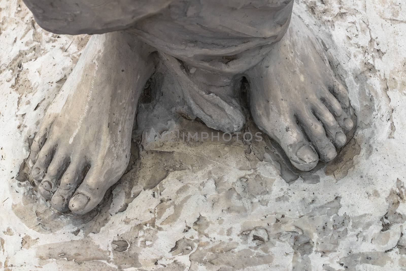 Marble sculpture depicting Jesus' feet.