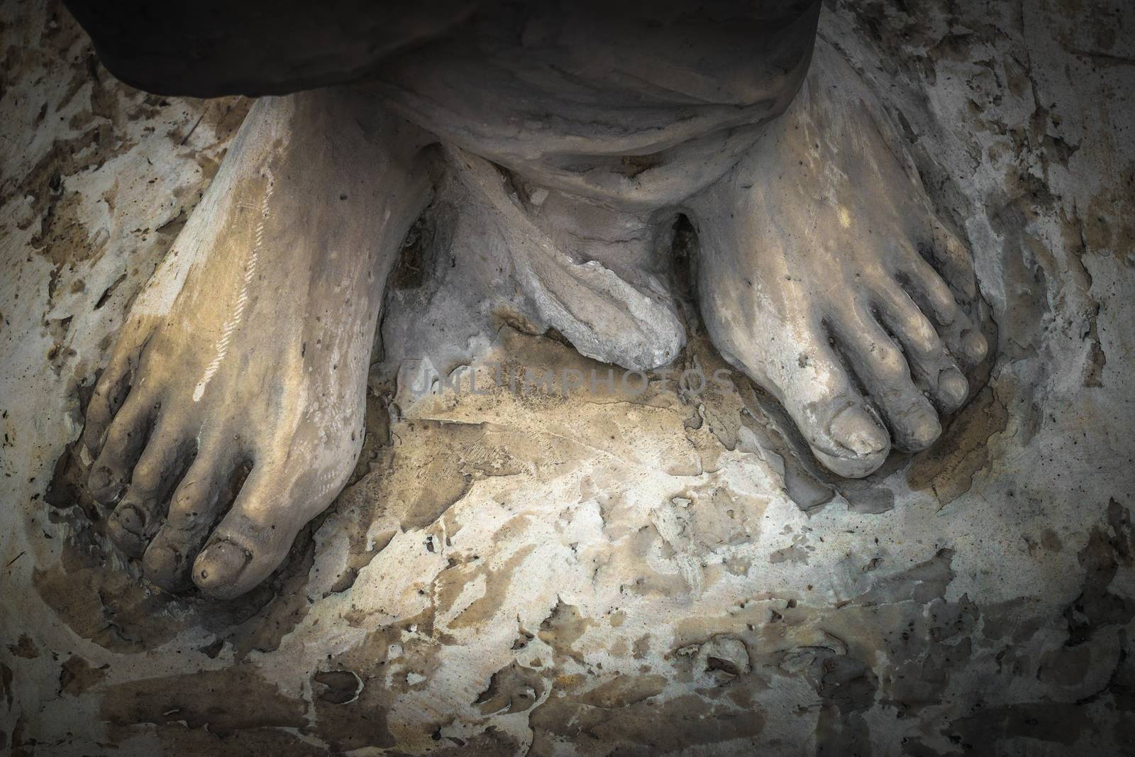 Marble sculpture depicting Jesus' feet.
