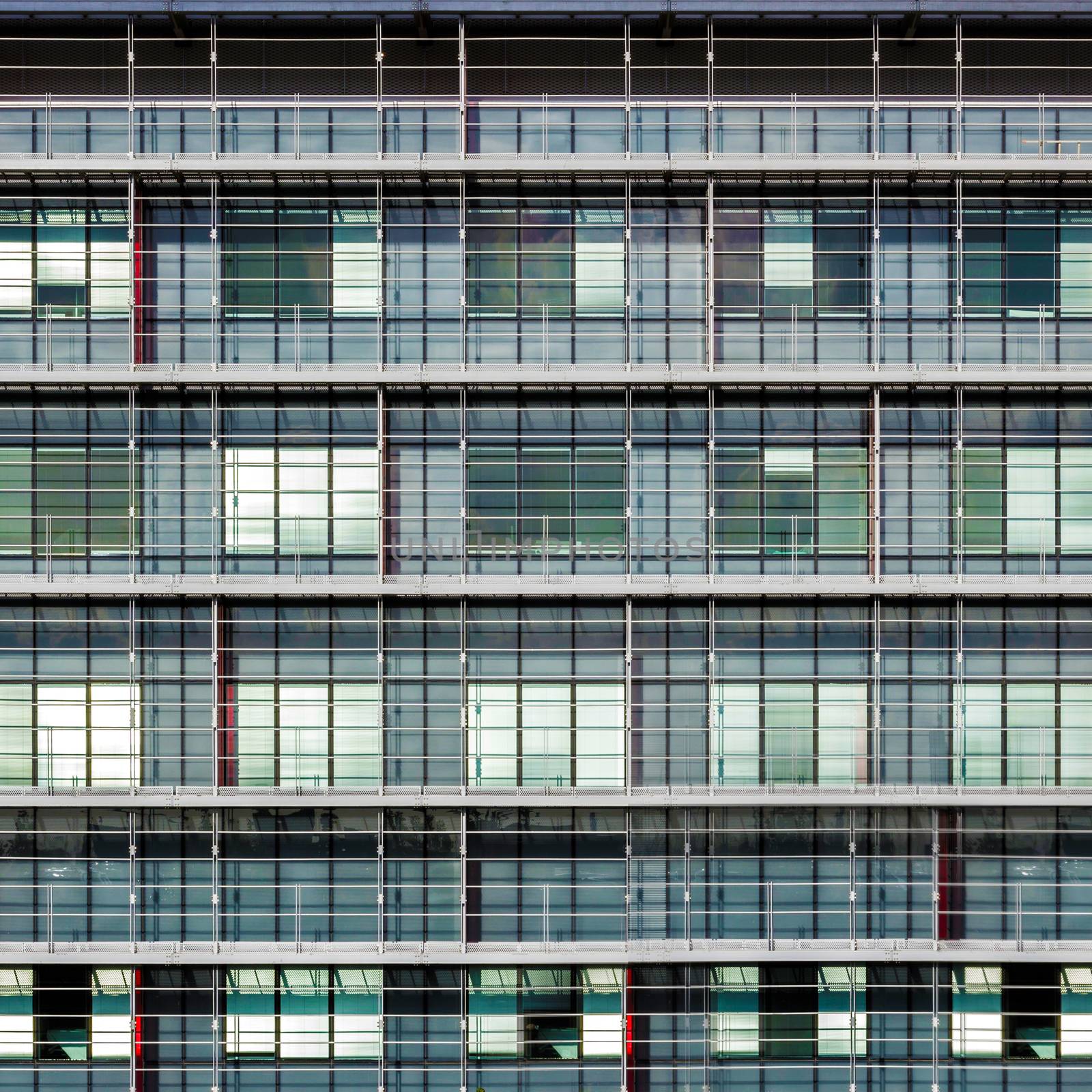 Facade of a modern multi-storey office building. Front view close up.