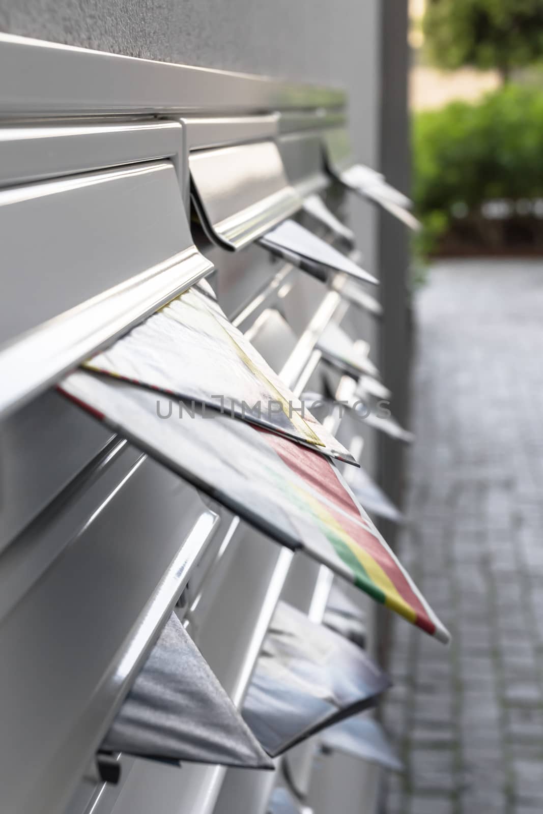 Modern mailboxes filled of leaflets. Business and advertising concepts. Shallow depth of field.