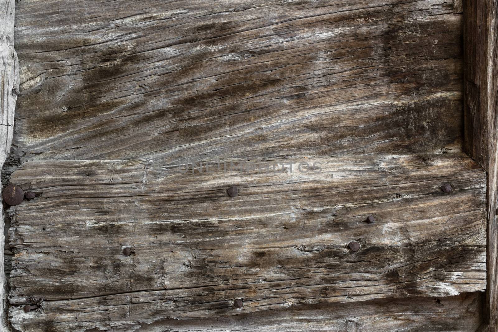 Wood background with grunge tones and rusty parts.
