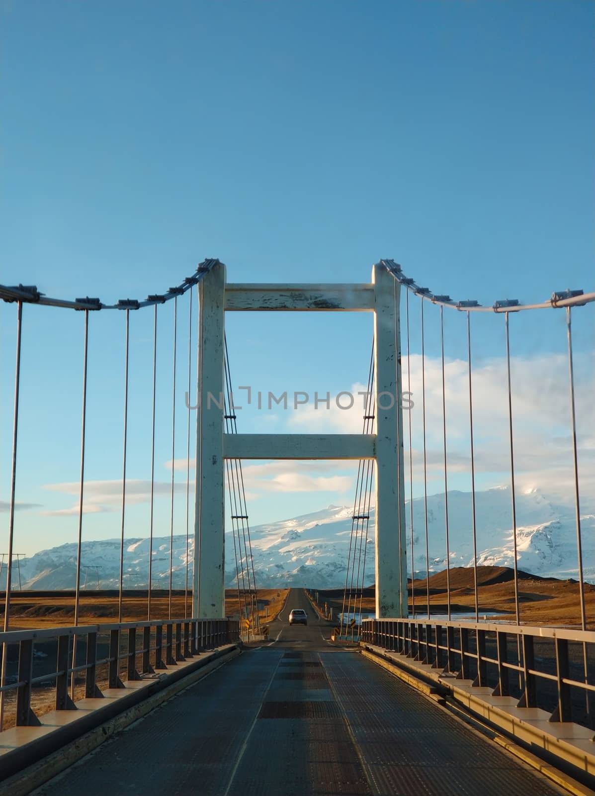 Jokulsarlon glacier lagoon bridge in Iceland at golden hour.