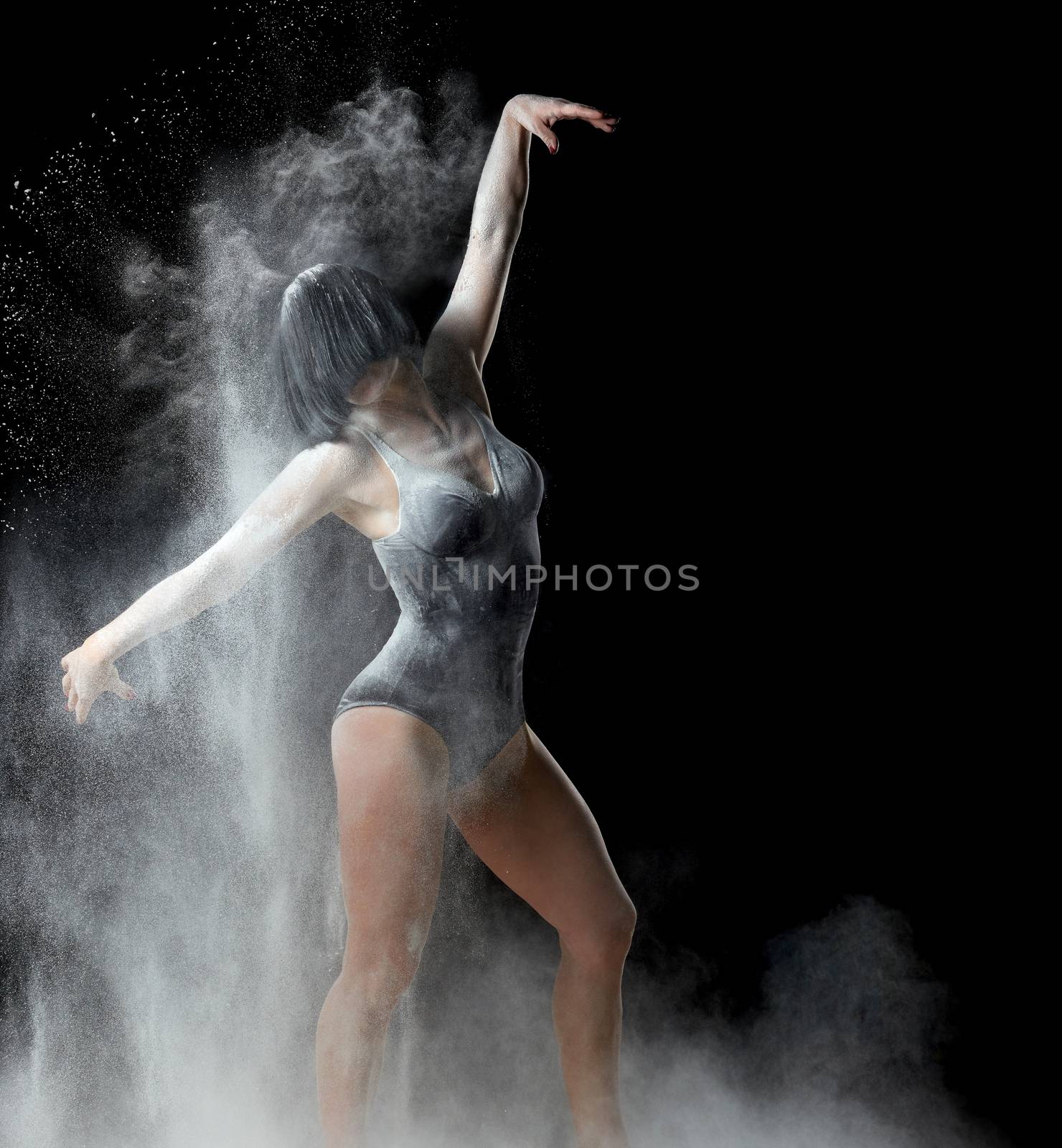beautiful caucasian woman in a black bodysuit with a sports figu by ndanko