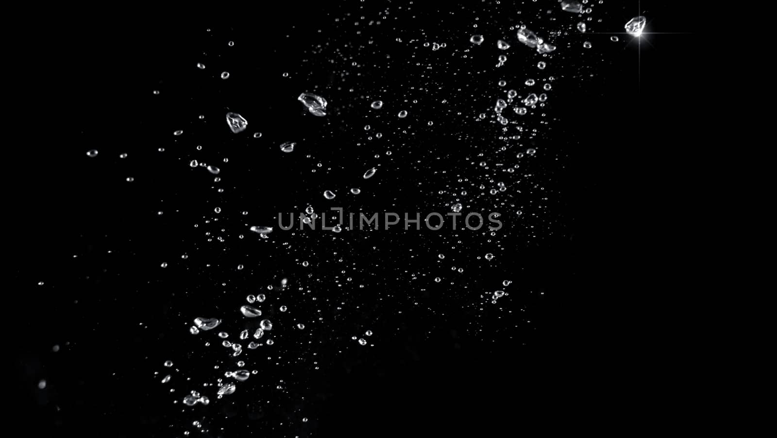 Blurred images of close-up soda water bubbles fizzing up or splashing or sparkling like a exploding of a bomb on black background for represent refreshing from carbonated drinks menu.