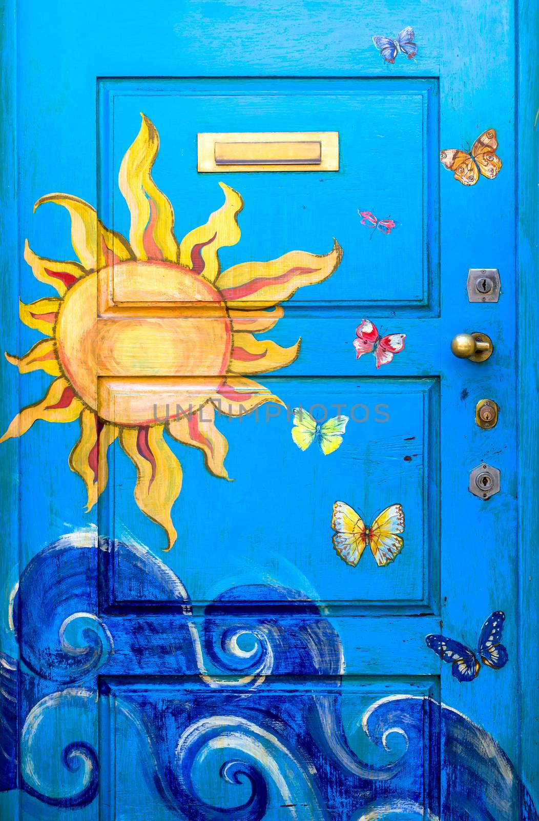 Graffiti at a door of a house in the street