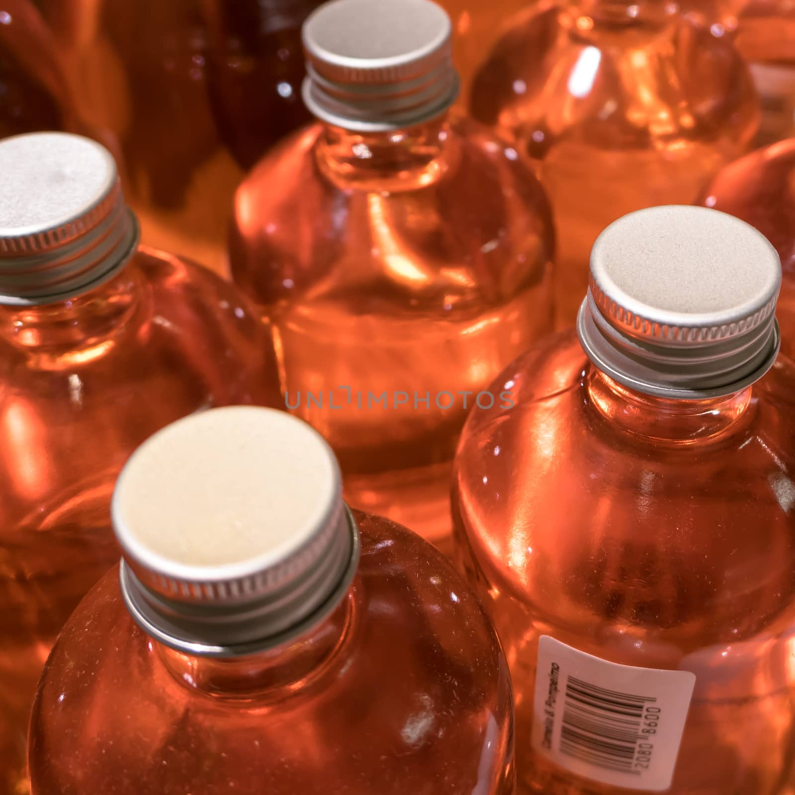 Orange cosmetic bottles by germanopoli
