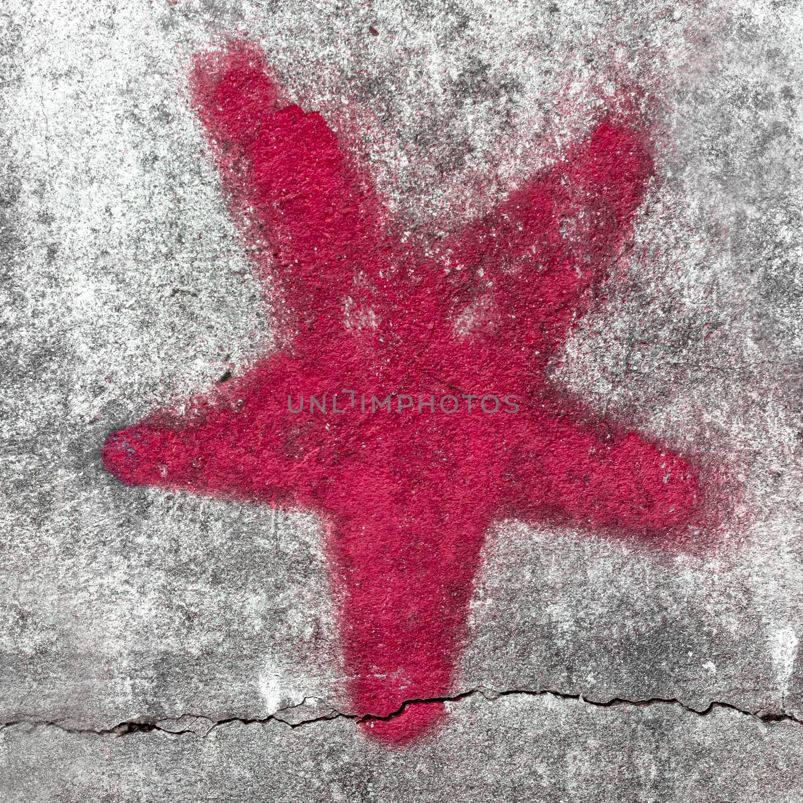 Red star painted on grungy wall