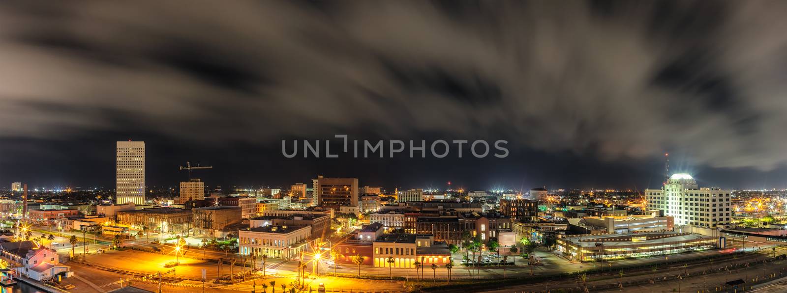 Beautiful panoramic aerial view of down town in Galveston, Texas. Long exposure. Night cloudy sky in the background.