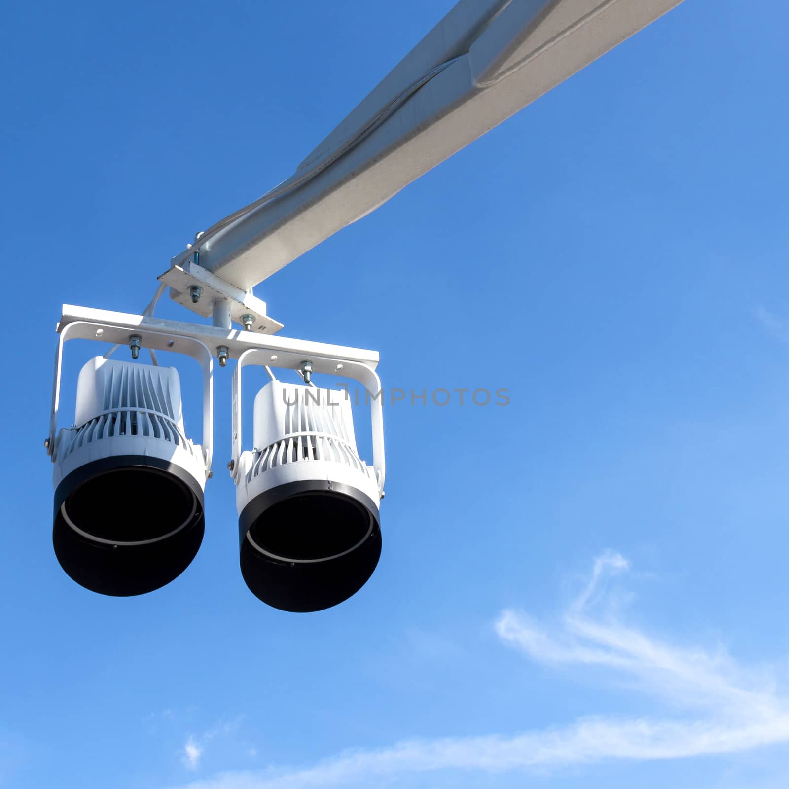 Two halogen spotlights and blue sky