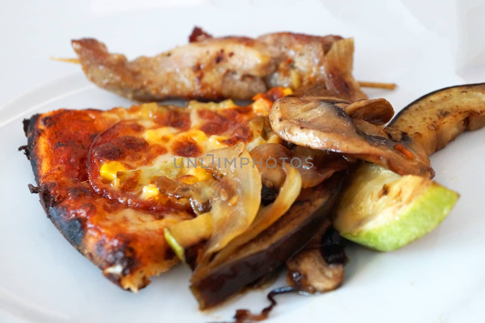 a slice of pizza with baked vegetables on a white dish. by Annado