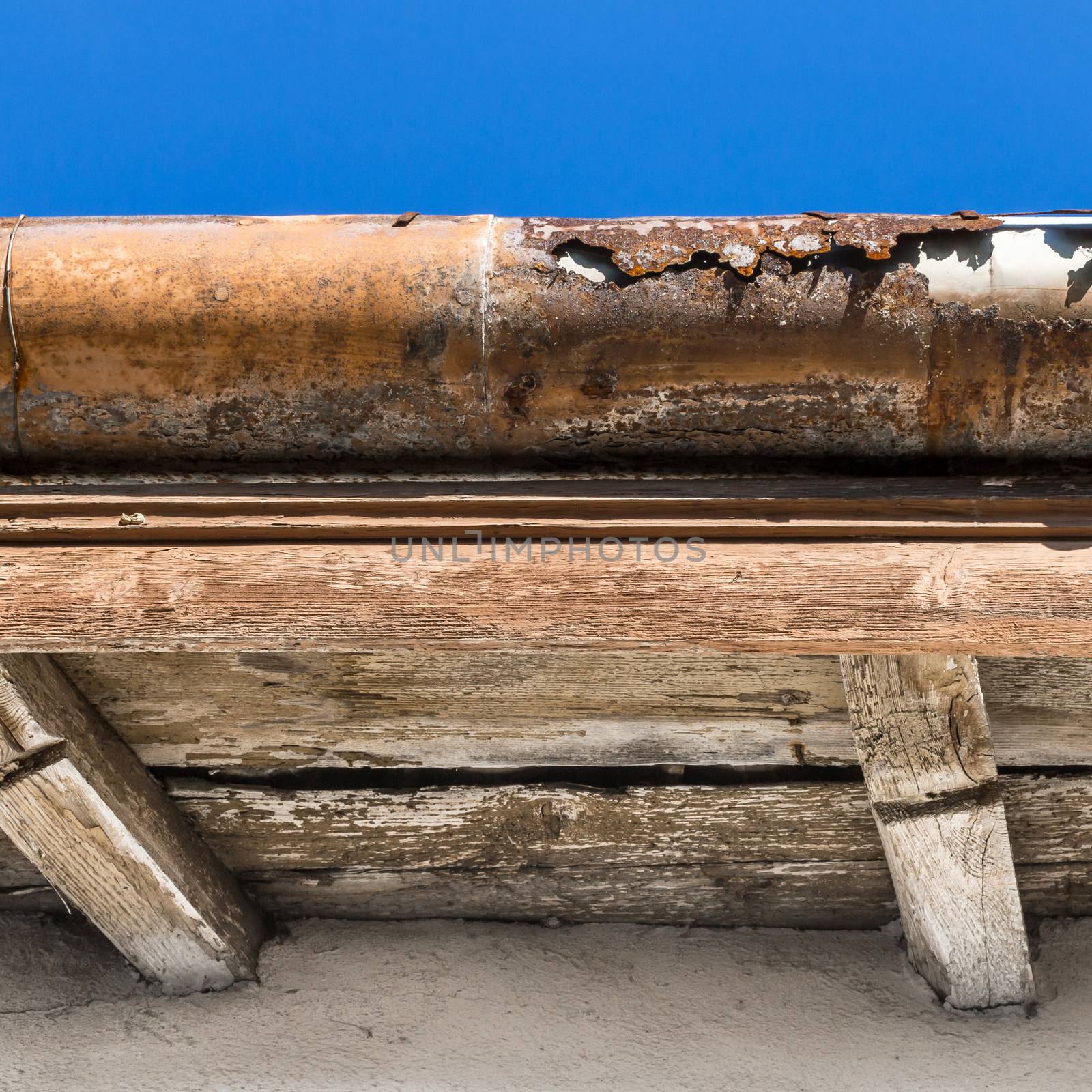 Broken gutter on the roof by germanopoli