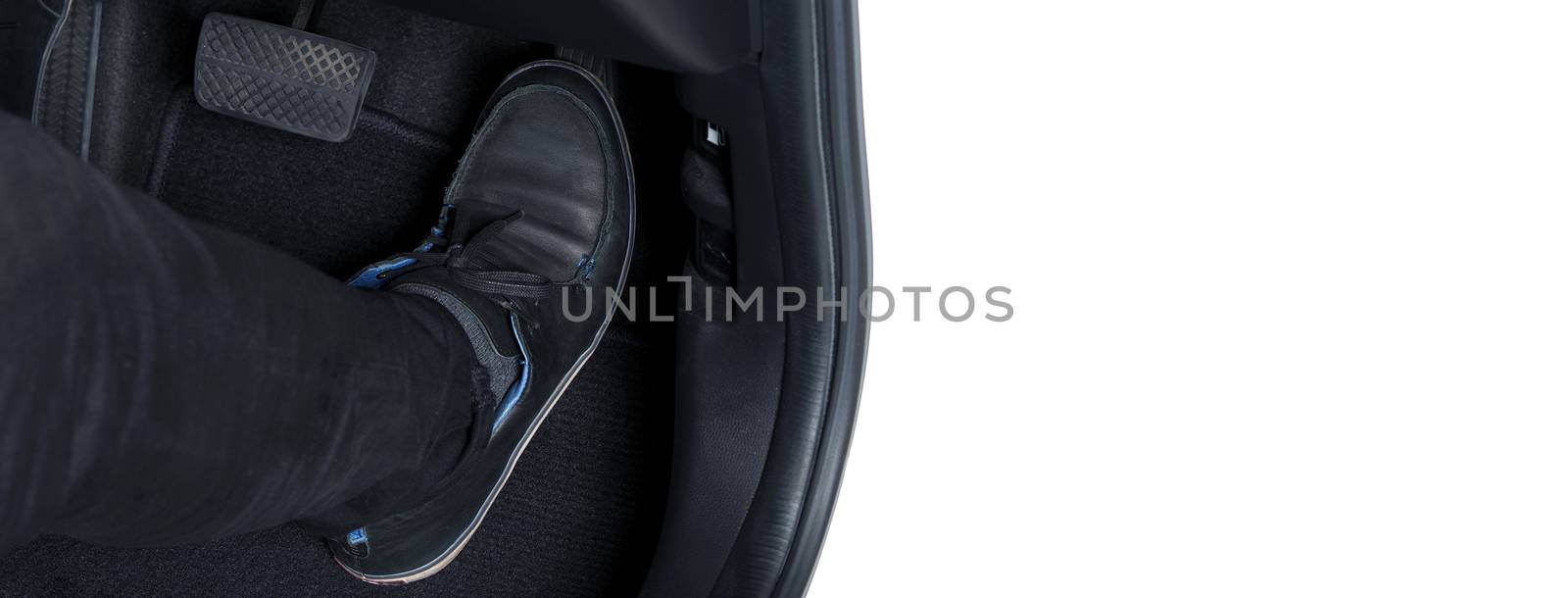 Man foot and accelerator and brake pedal inside the car or vehic by gnepphoto