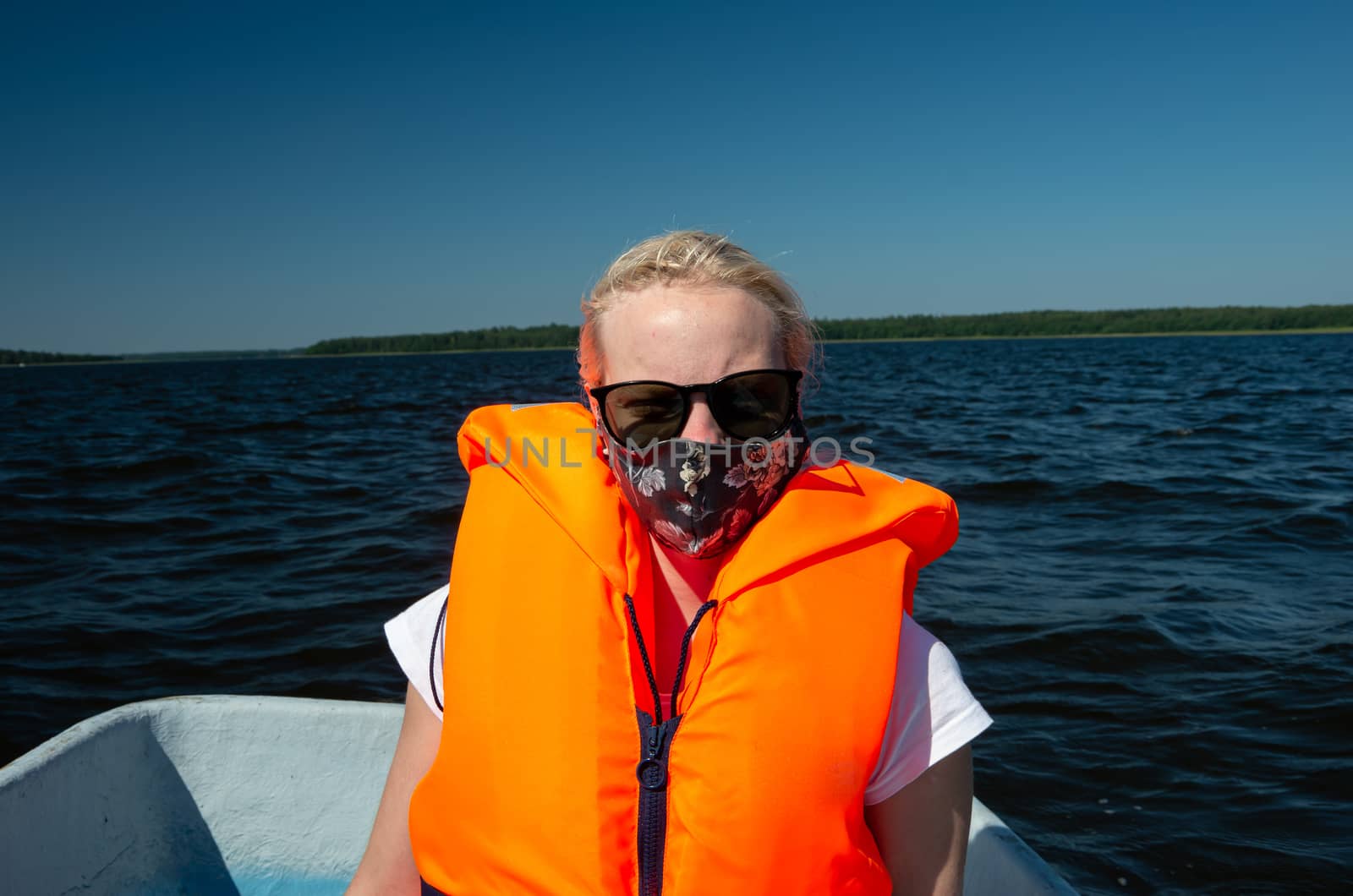 Woman in the lake with life jackets and face mask, Covid-19, coronavirus, water