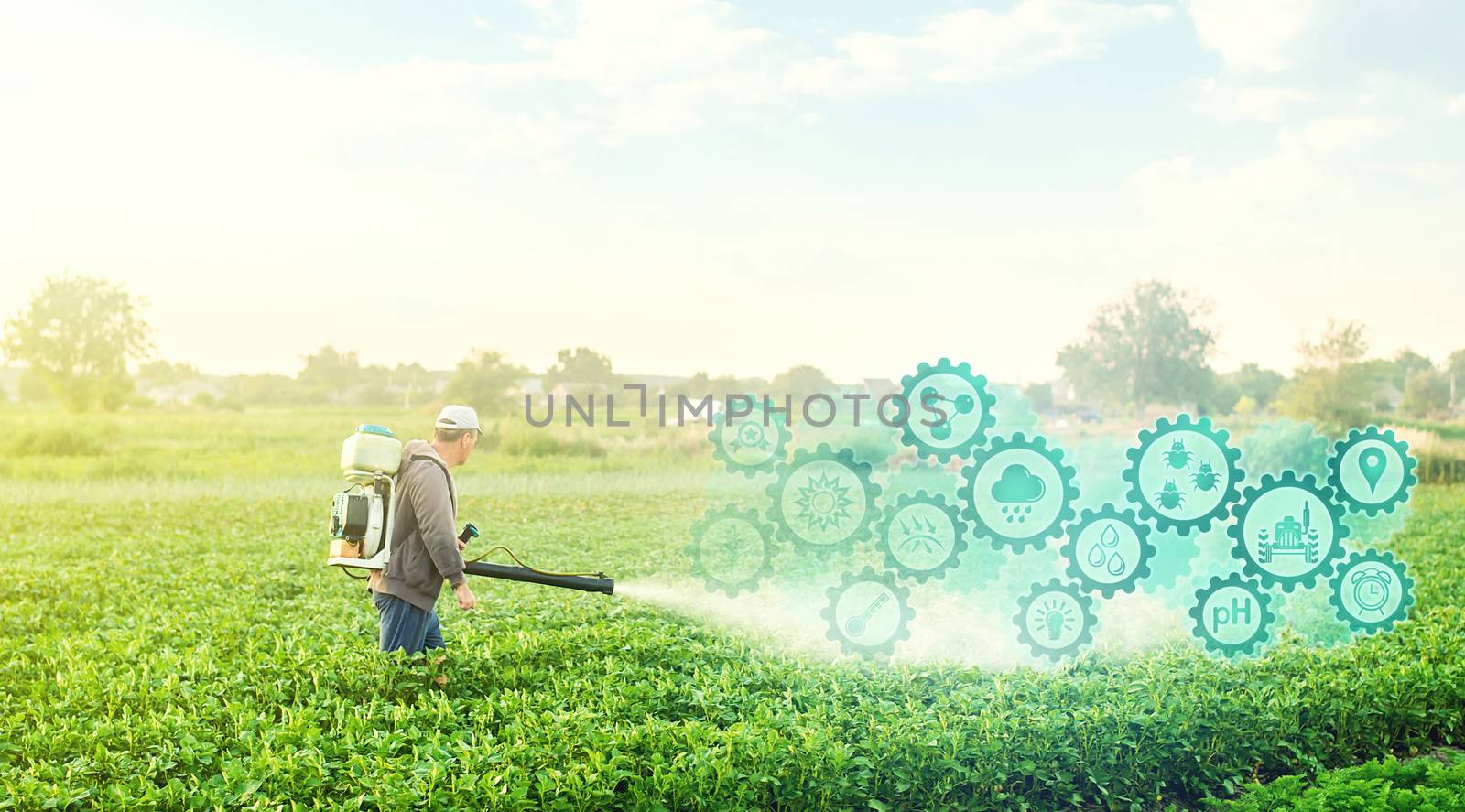 A farmer with a mist blower on potato plantation and technological innovation gears hologram. Using science and technology in agriculture to improve the efficiency and productivity of food production. by iLixe48