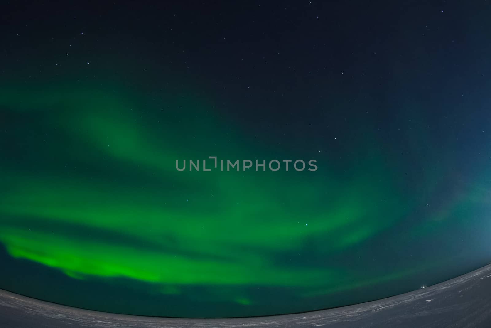 Northern Lights in the night sky. Northern Lights in the tundra.