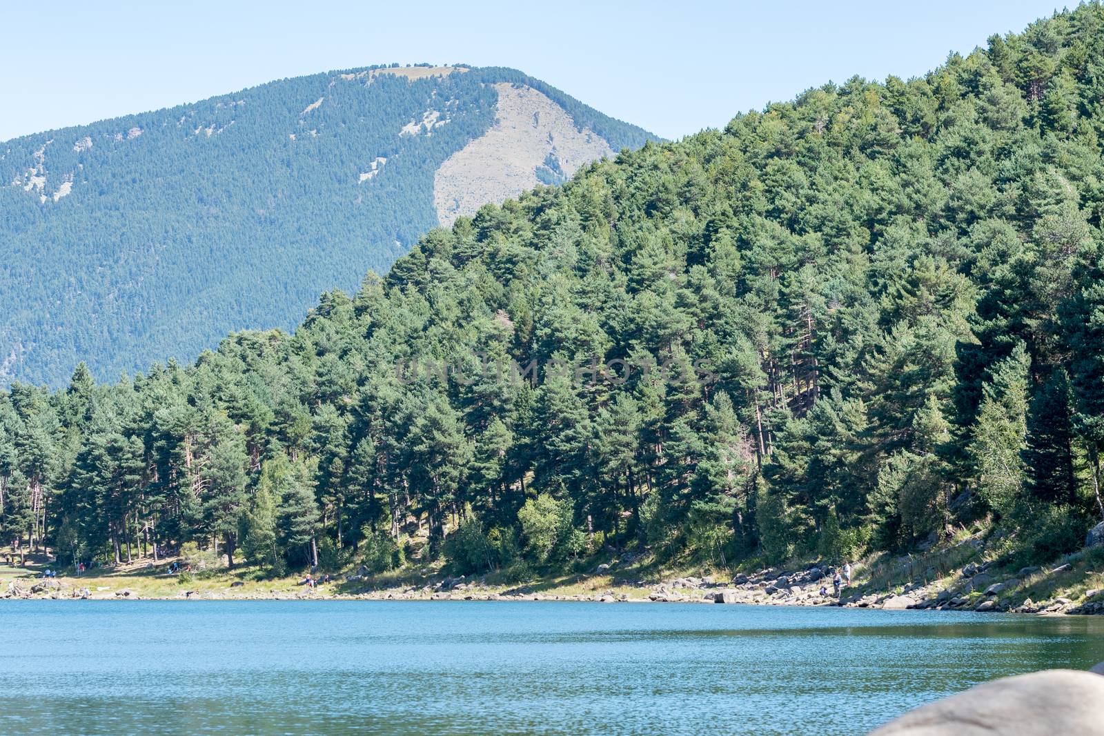 Summer afternoon at Lake Engolasters in the Pyrenees. Escaldes Engordany, Andorra.