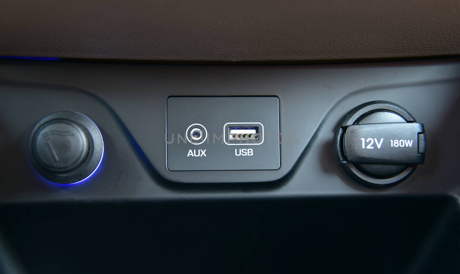 12V socket, USB port, AUX port on car dashboard and car cigarette lighter. Electric detail in car.