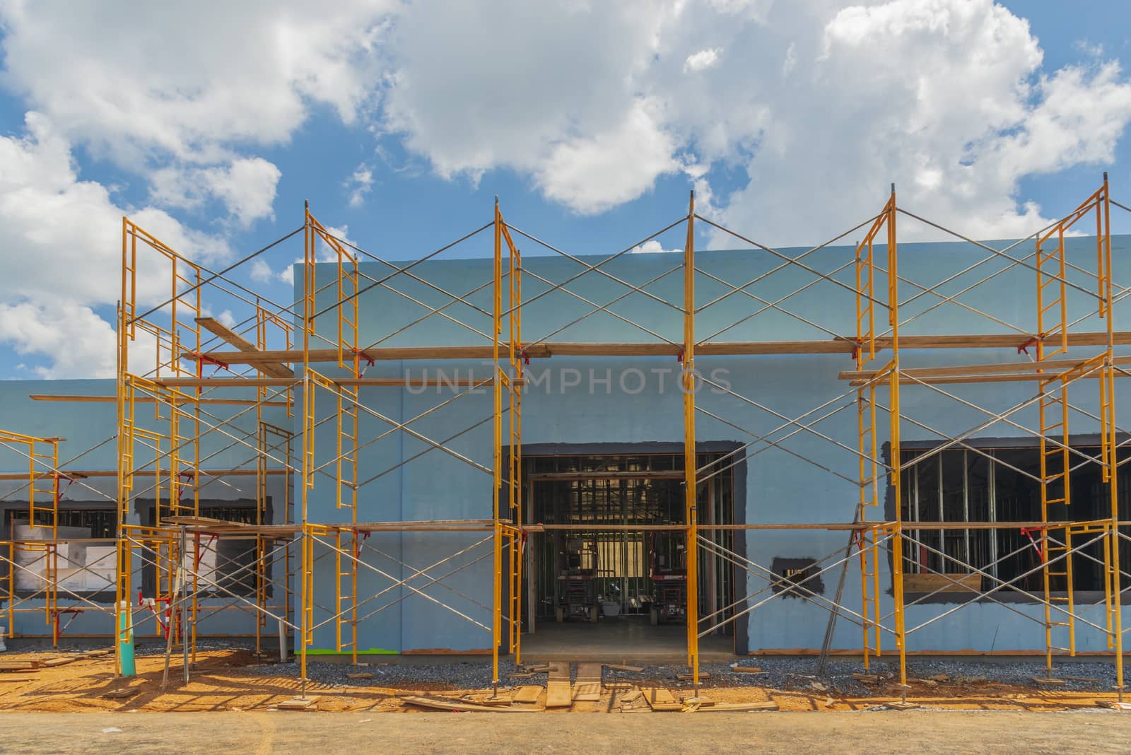 Scaffolding Surrounds New Commercial Building Construction by stockbuster1