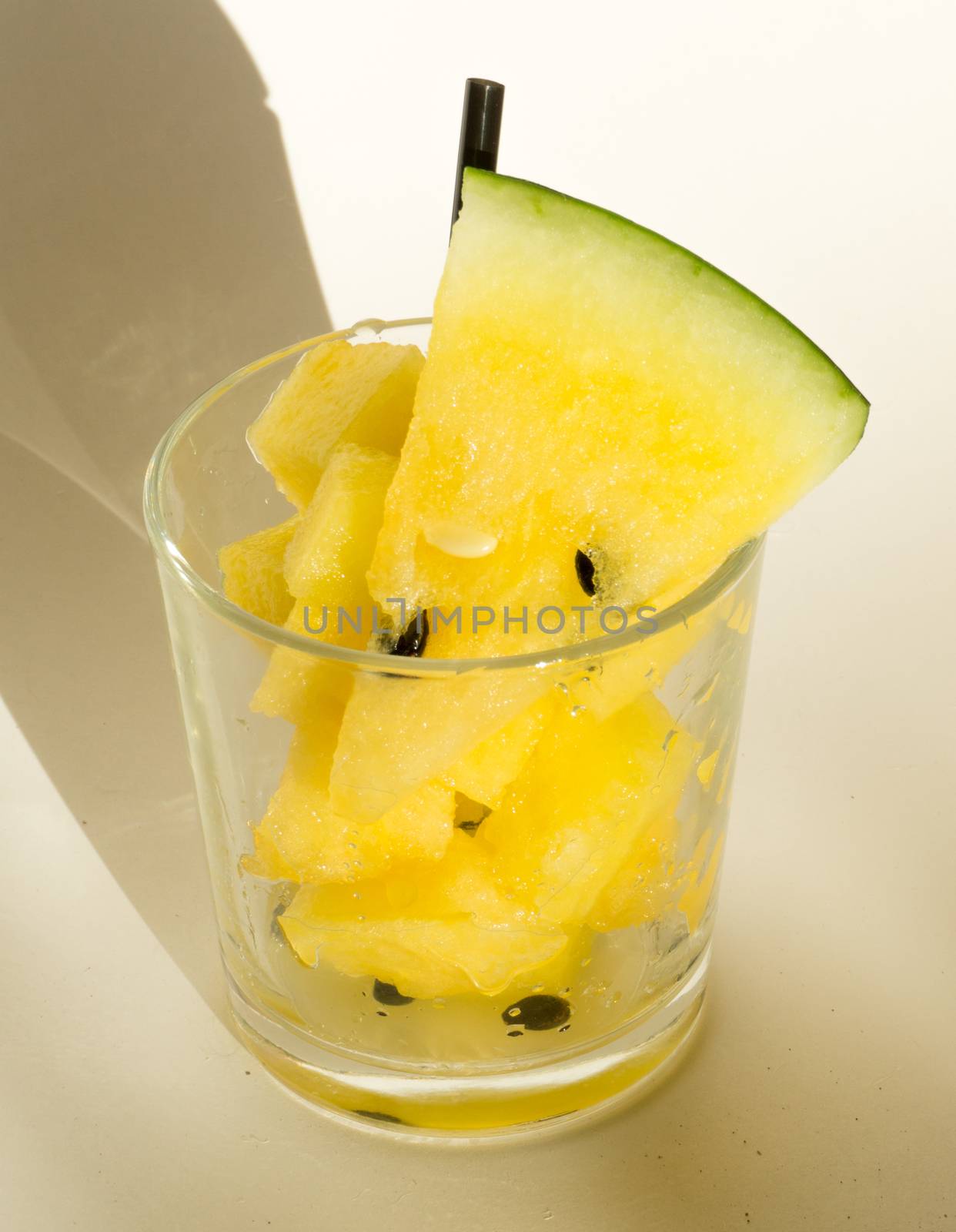 Yellow watermelon in a glass with slices and wedges for Watermelon diet